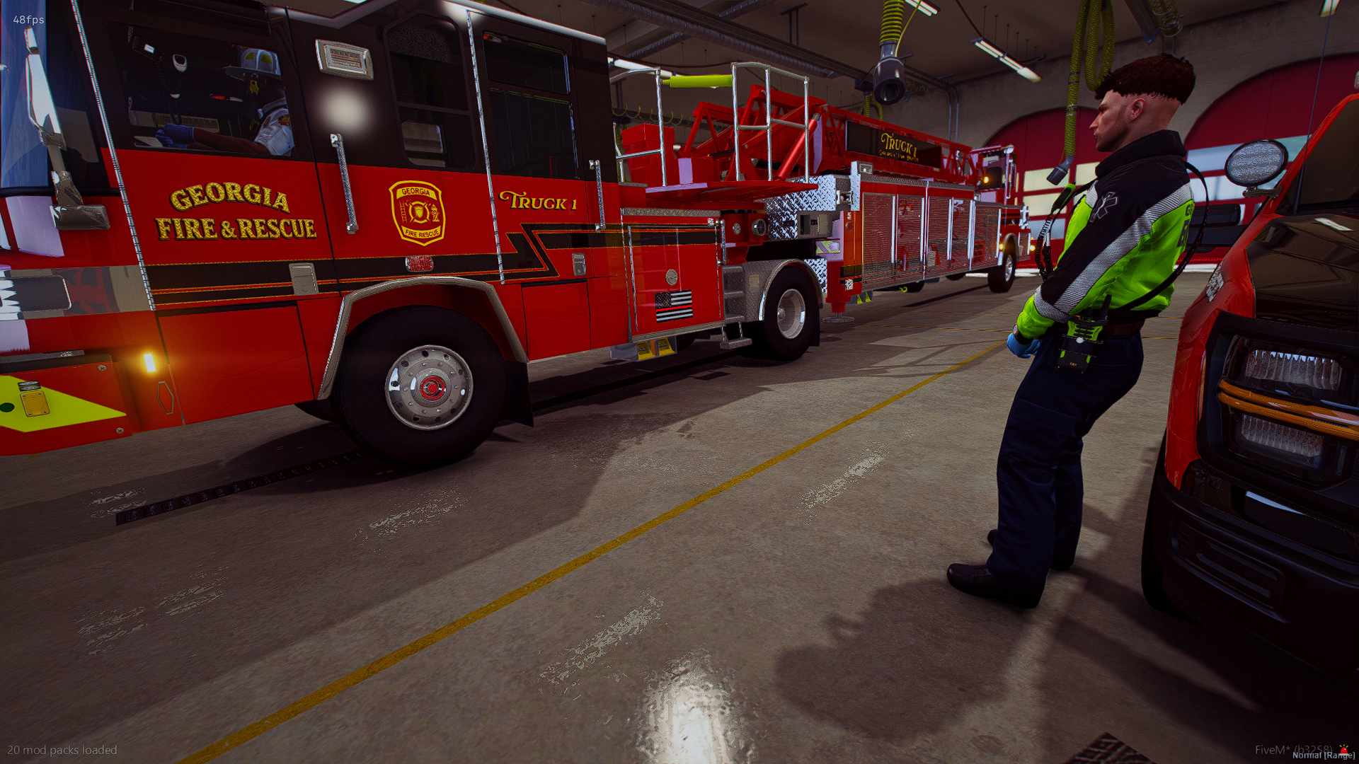 A firefighter in a black and green uniform standing in front of a red Georgia Fire & Rescue fire truck inside a fire station garage.