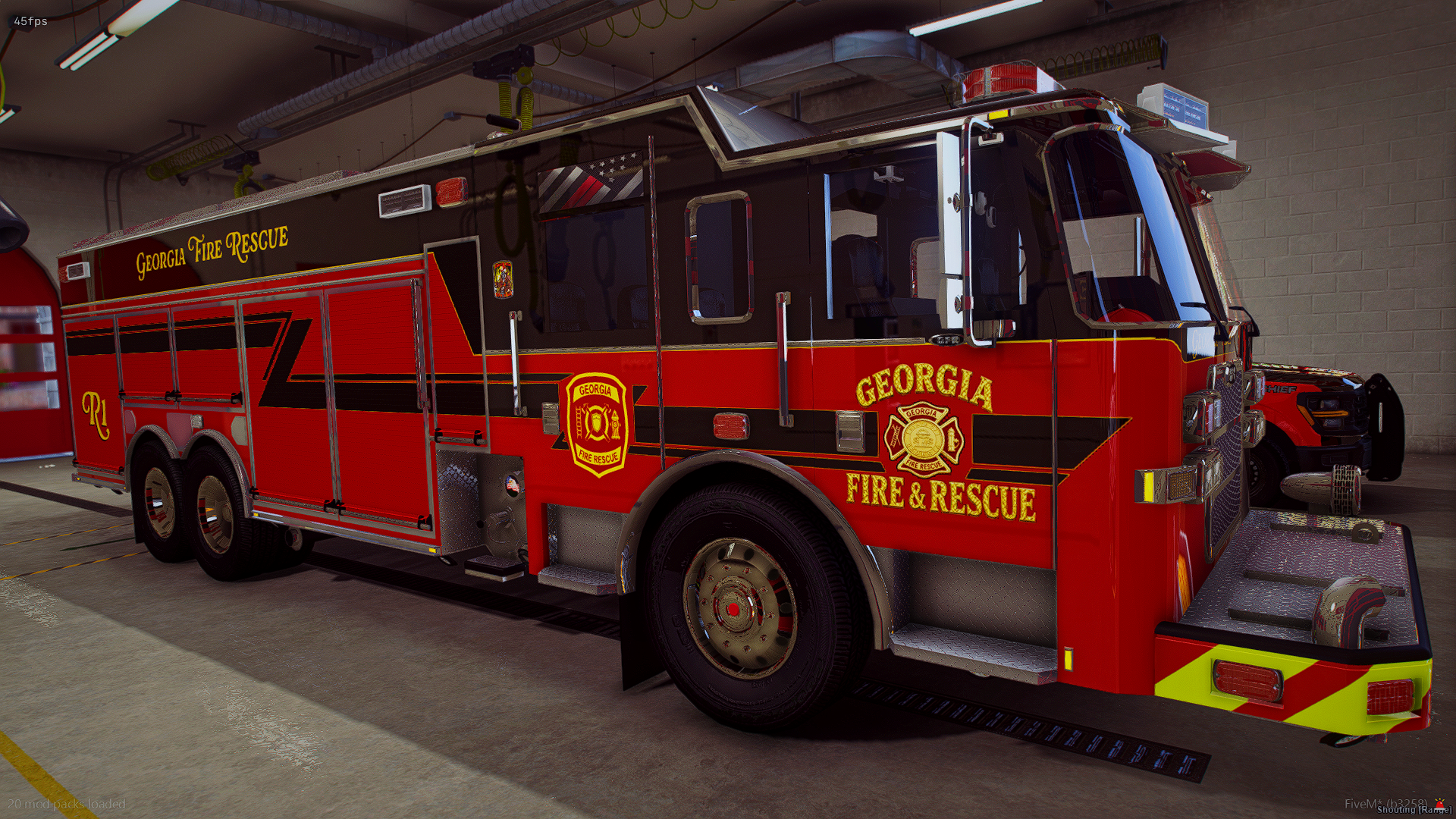 Red Georgia Fire Rescue fire truck parked inside station with equipment on its side and front