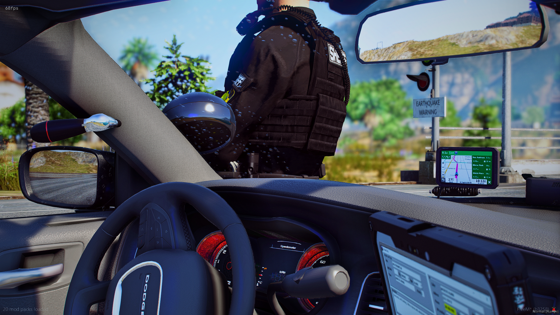 Inside a car, a police officer in uniform is leaning into the window, which is being held down by a hand. The dashboard includes a GPS device showing a route and a speedometer, and the rearview mirror displays an earthquake warning sign. The scene ap