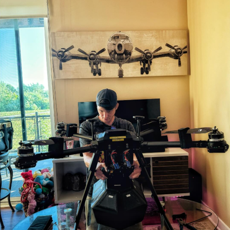 Image of Flightbox CEO Barrett Stubbs working on Flightbox v1 MVP with drone.