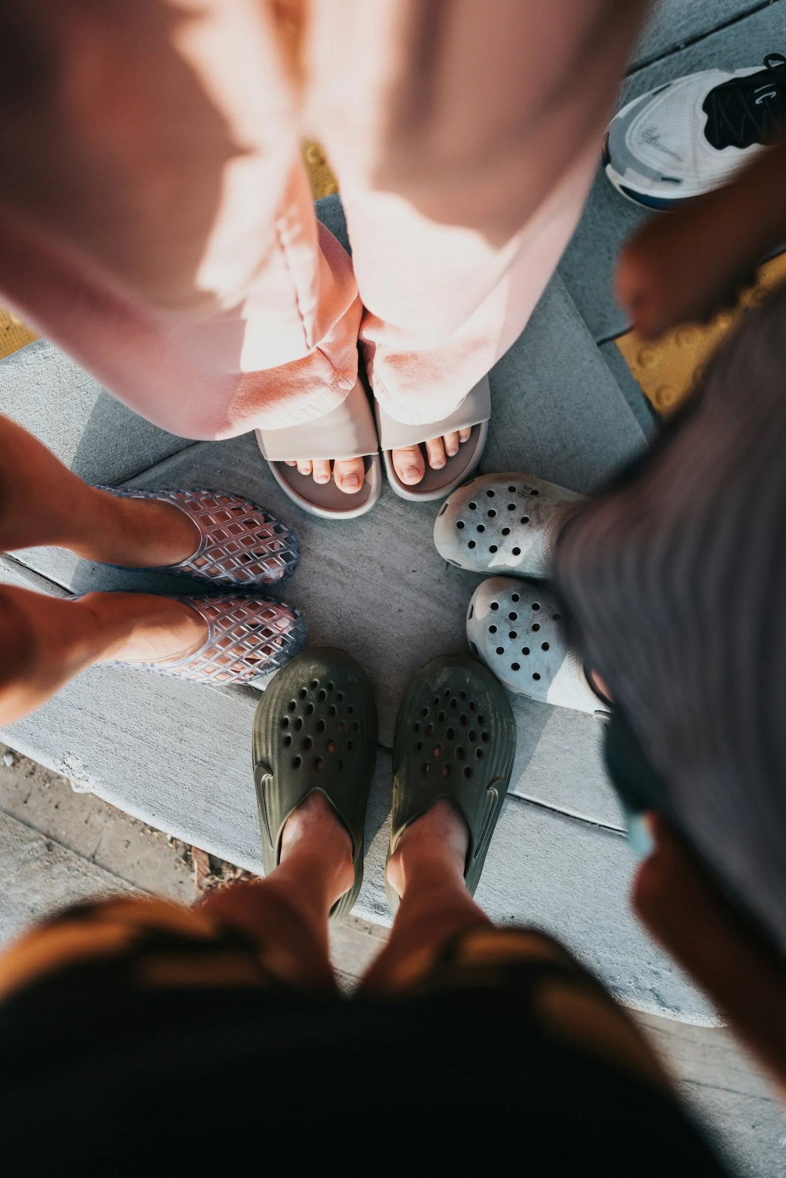 Small circle of women with view of their shoes