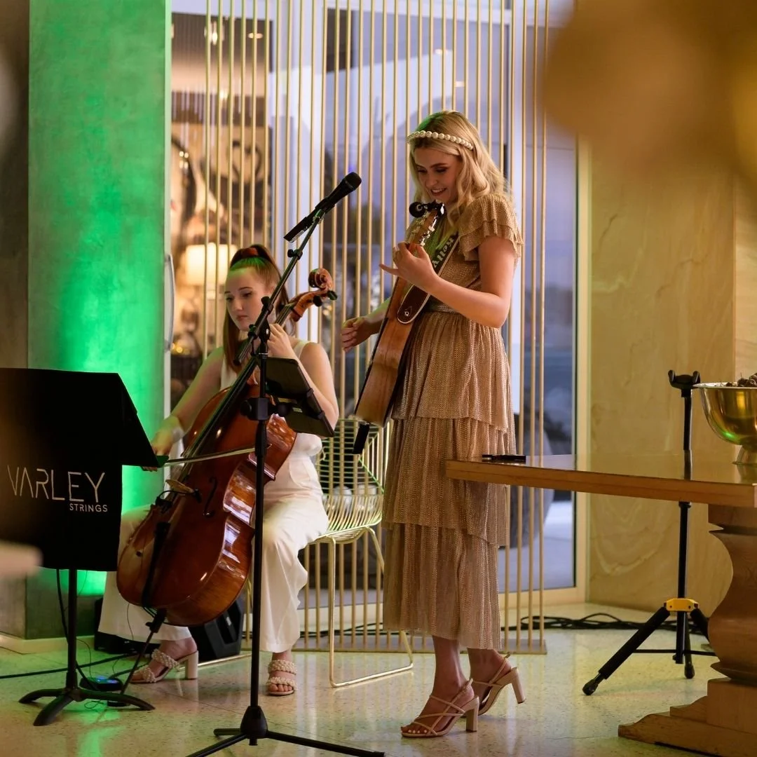 Stella Kelly performing in a trio format at a Christmas party in Applecross with a violin and cello