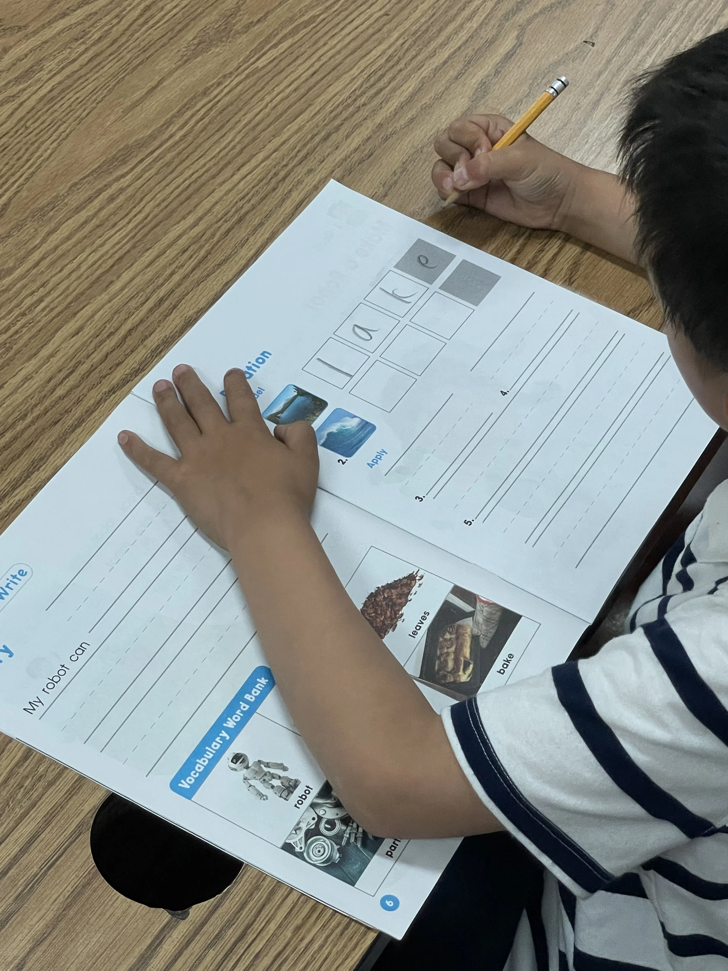 PT boy writing vocab.jpeg