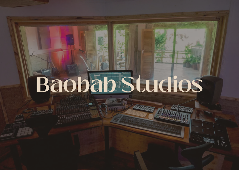 Recording studio with various audio equipment including speakers, a mixing console, and a computer monitor. Recording Studio kenya kilifi