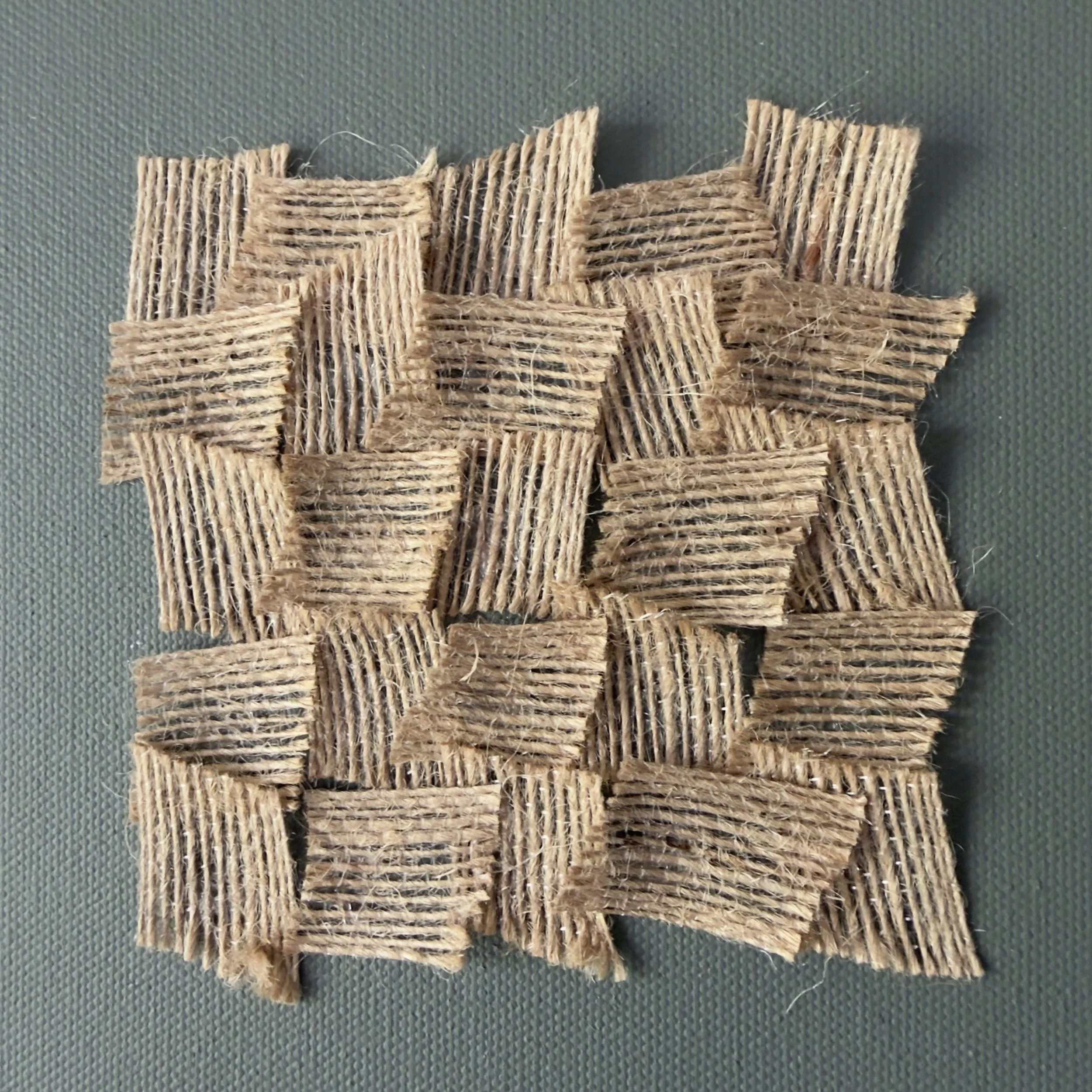 IMG_1690.jpeg a trio of 12x12 inch abstract fabric artwork with burnt green earth shade and a hessian fabric