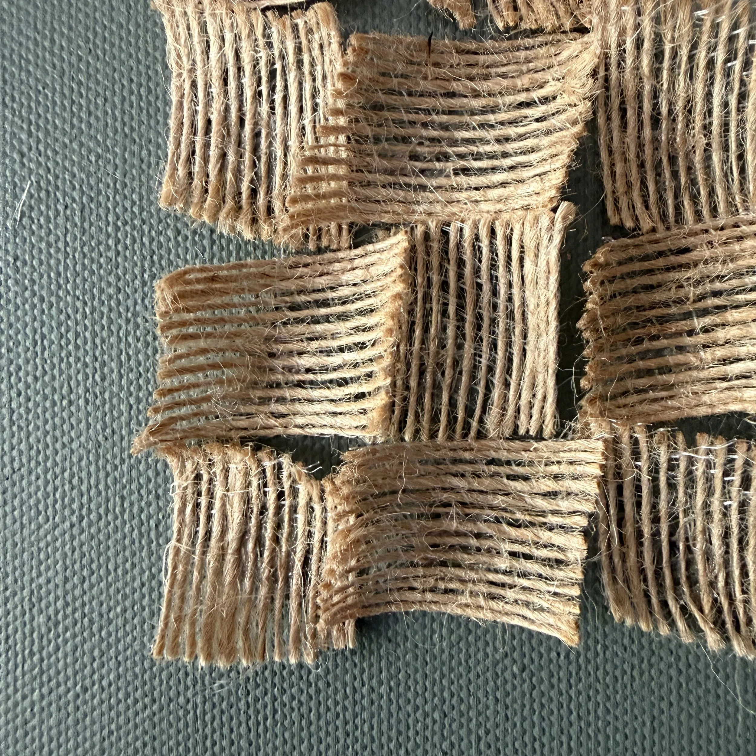 IMG_1695.jpeg a trio of 12x12 inch abstract fabric artwork with burnt green earth shade and a hessian fabric