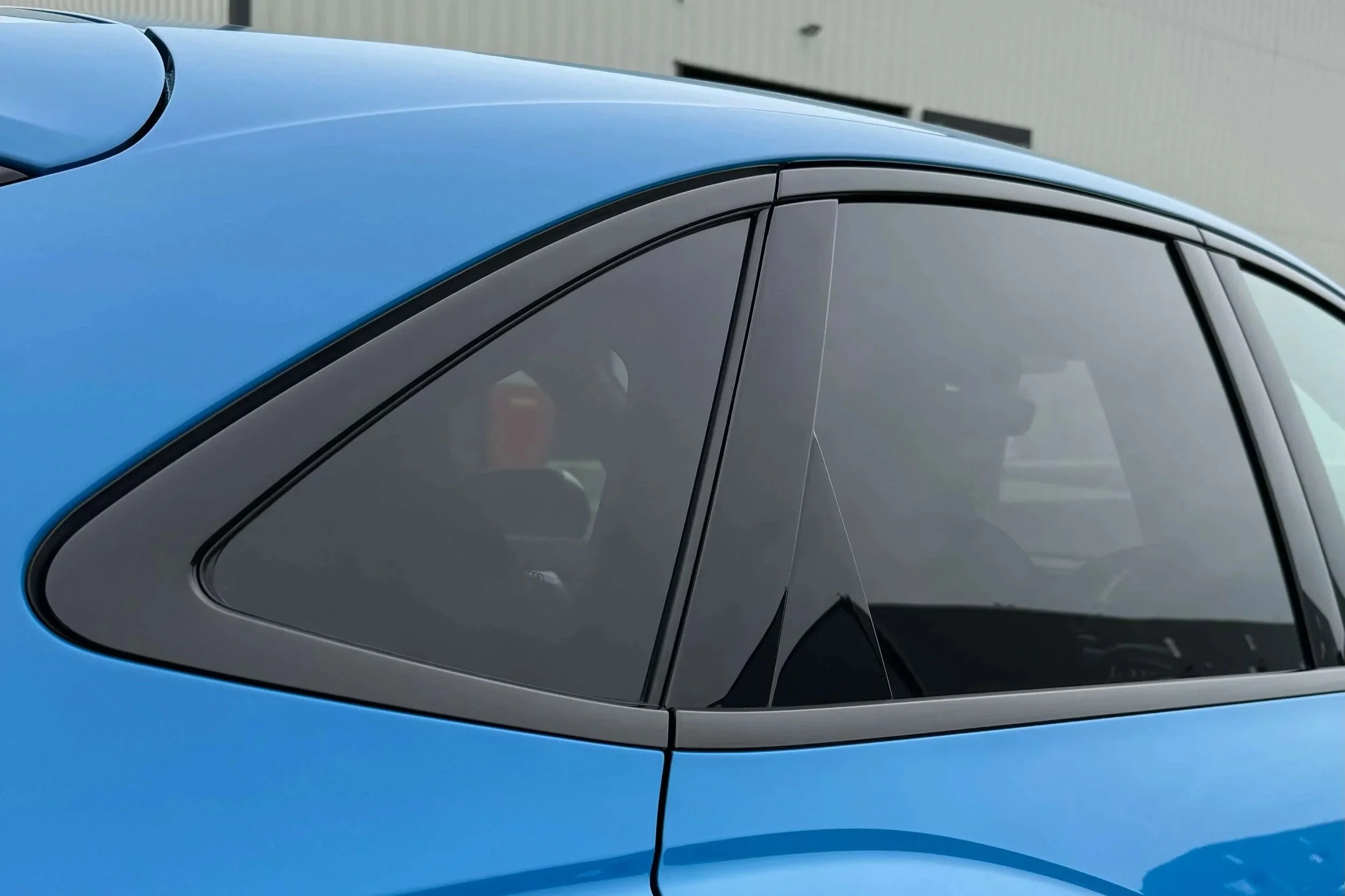 Vehicle window trim dechrome wrapped in gloss black vinyl