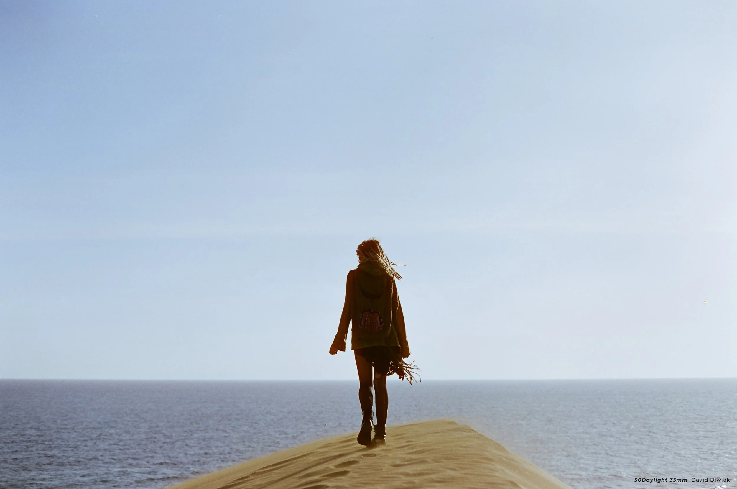 cinestill 50D sample photo of woman stood on beach