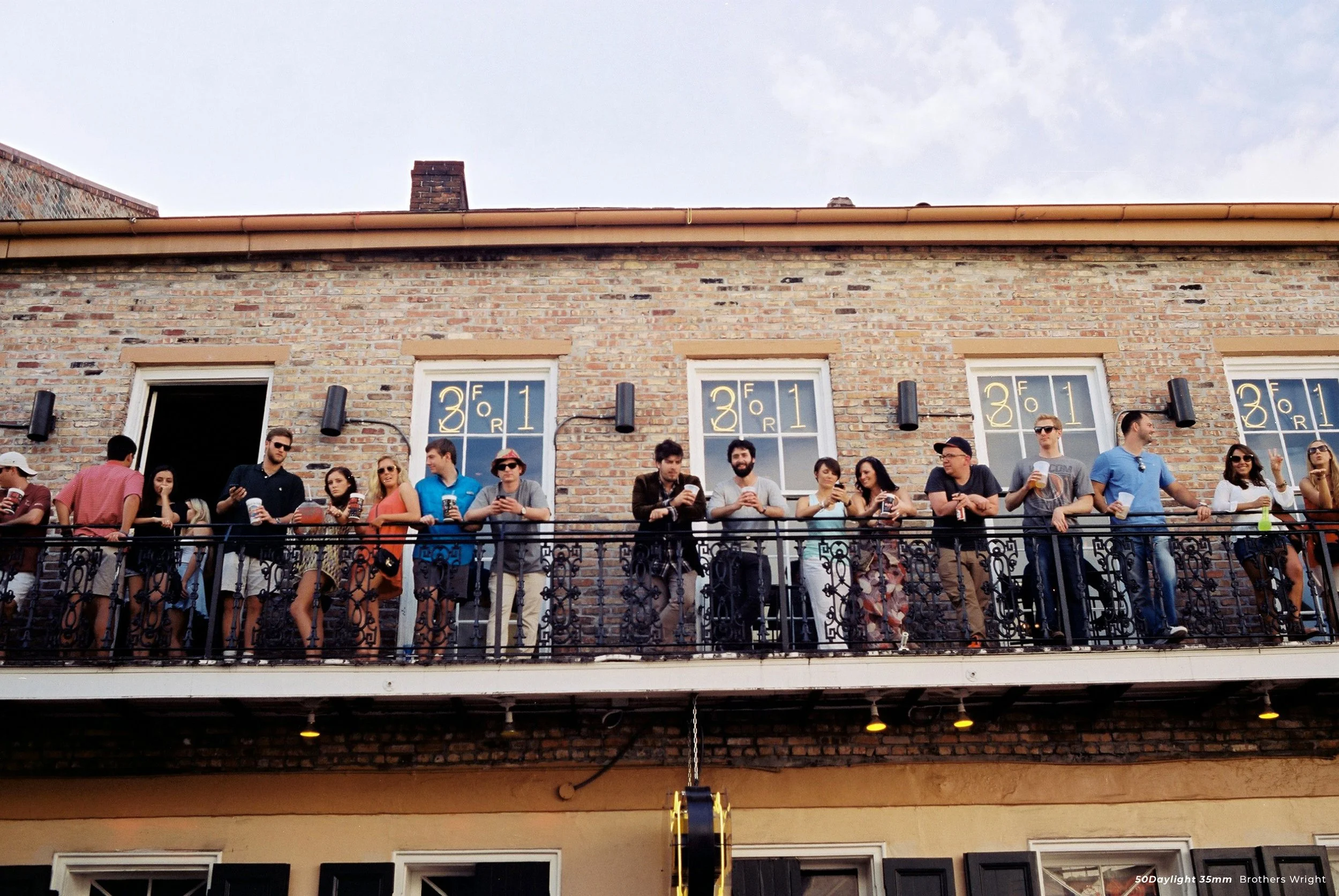 cinestill 50D sample photo of crowd standing on balcony
