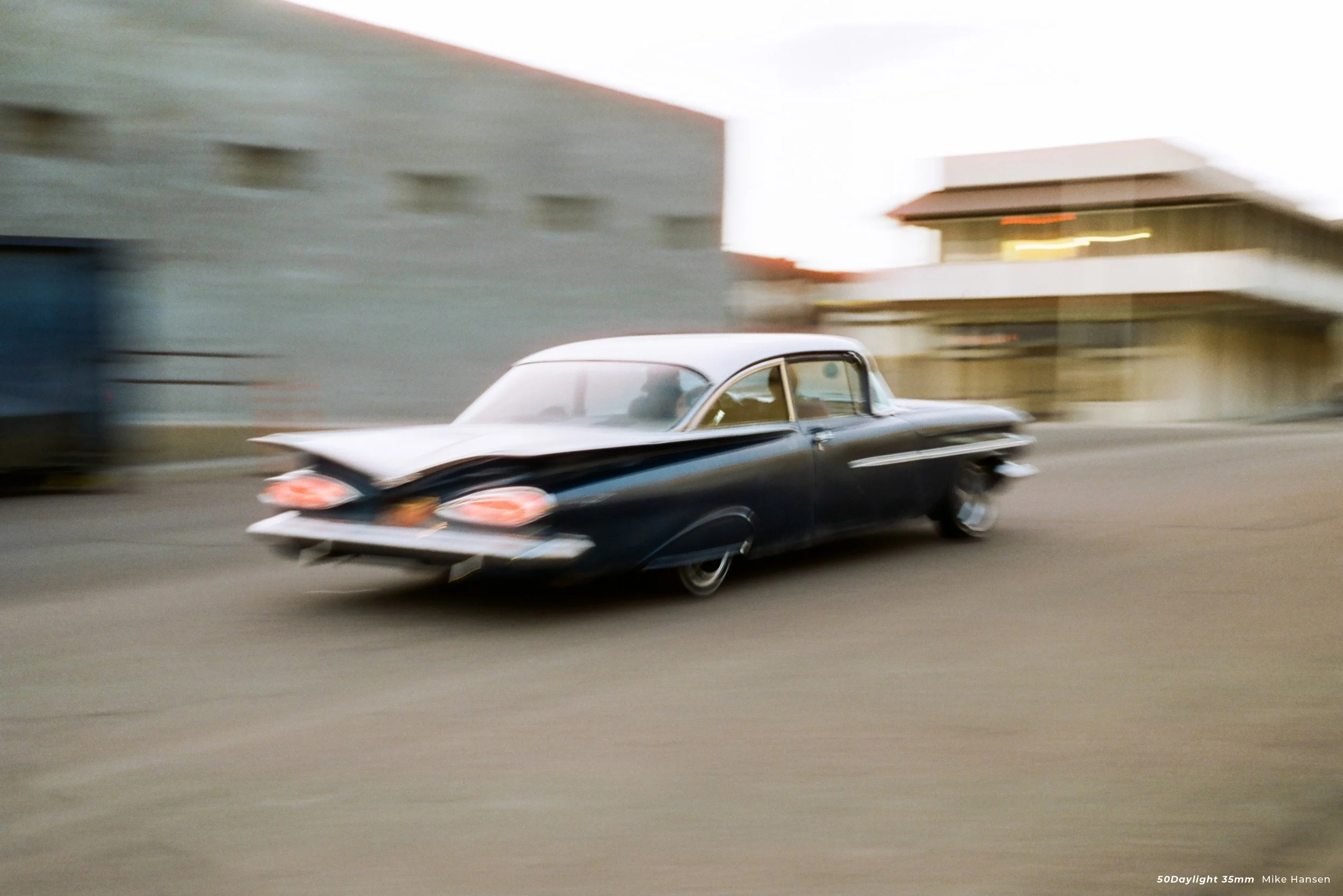 Cinestill 50D product photo of a retro car speeding off
