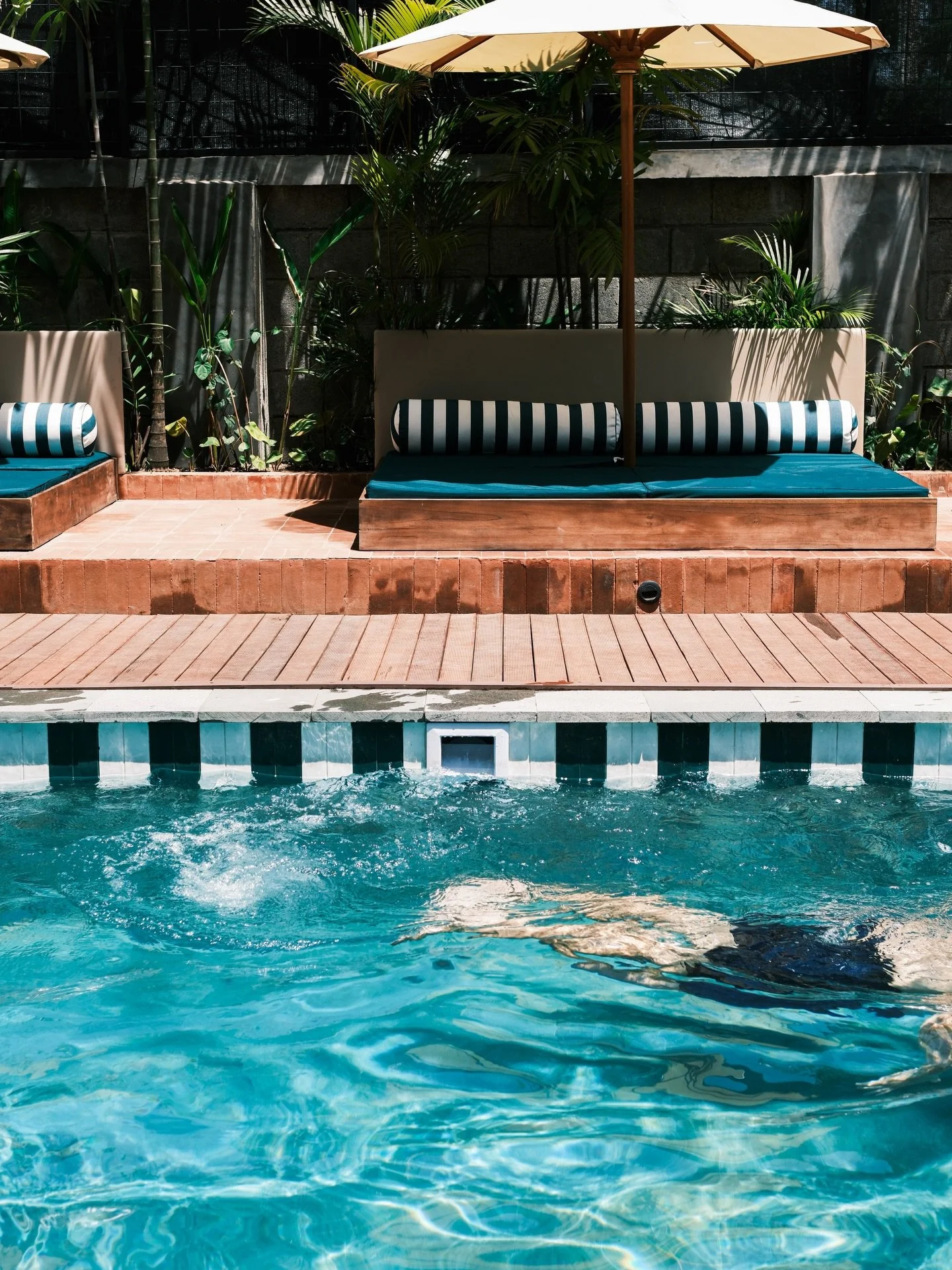 Sun on the water, a seat by the side. Somewhere between a dip and a pause.