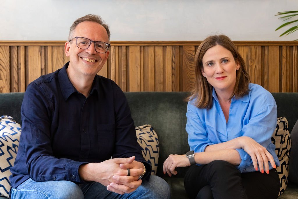 Jonathan Phillips and Sharon O'Dea sitting on a sofa