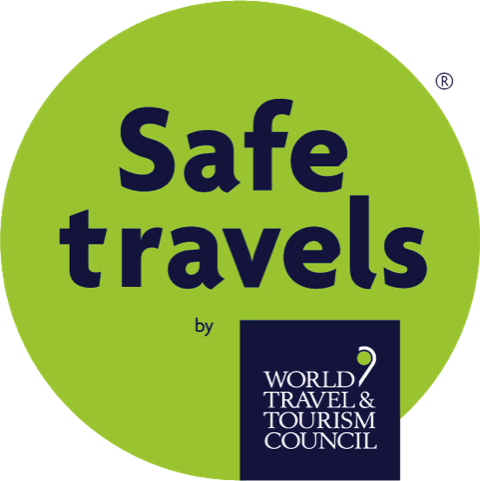 Green circular logo with the words 'Safe travels' and the logo of the World Travel & Tourism Council.