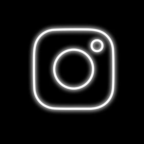Neon Instagram logo on a black background.