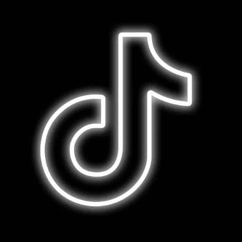 Neon sign of the TikTok logo on a black background.