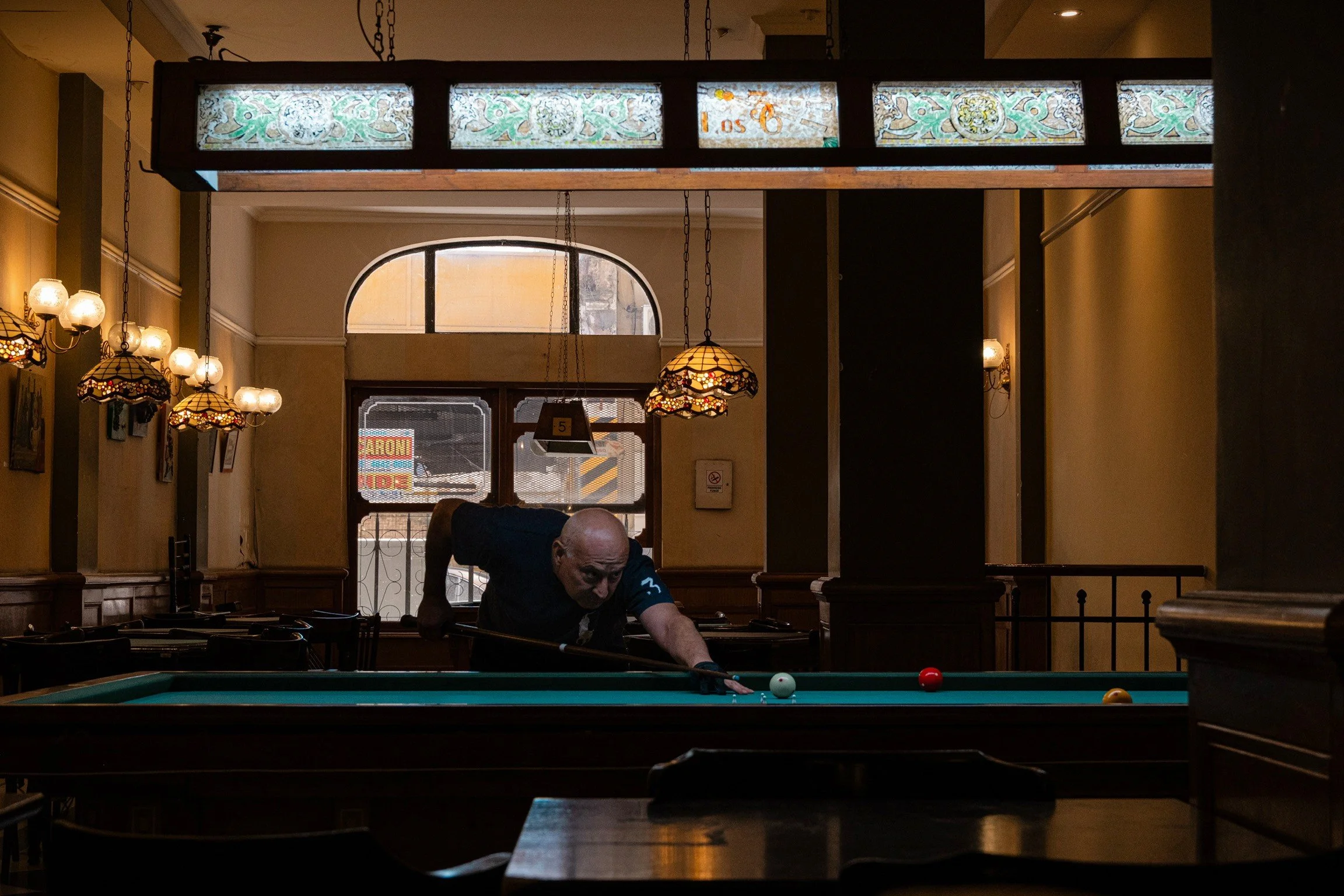 An individual plays pool at Los 36 Billares in Buenos Aires, Argentina, on Jan. 5, 2026.