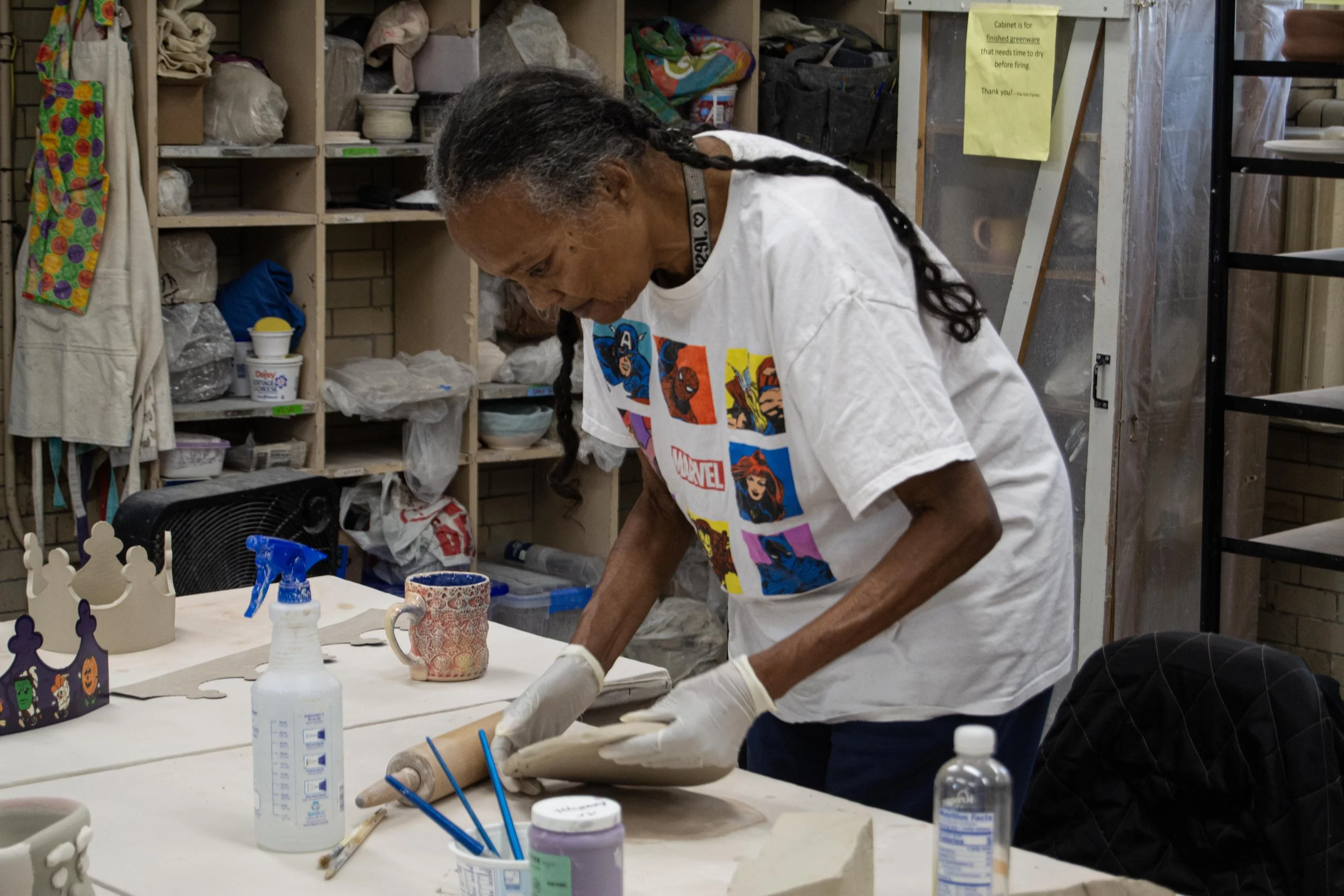 Valencia Howard, who is visually impaired, creates nameplates for her grandkids at the Athletic Field Ceramics Building in Irving Park on Wednesday, Nov. 4, 2025.