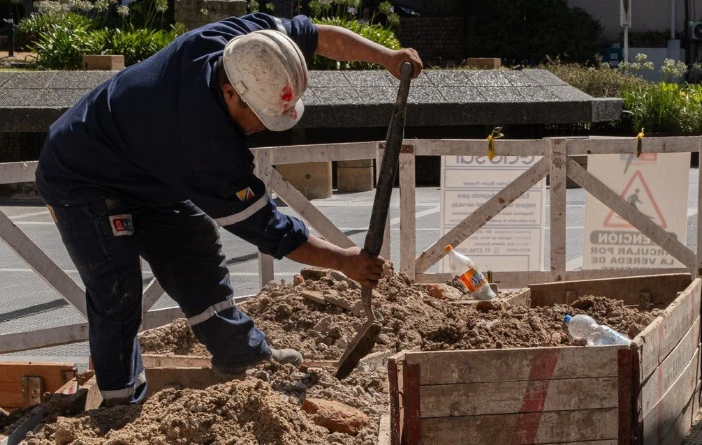 A construction worker digs away at dirt in Buenos Aires, Argentina, on Jan. 5, 2026.