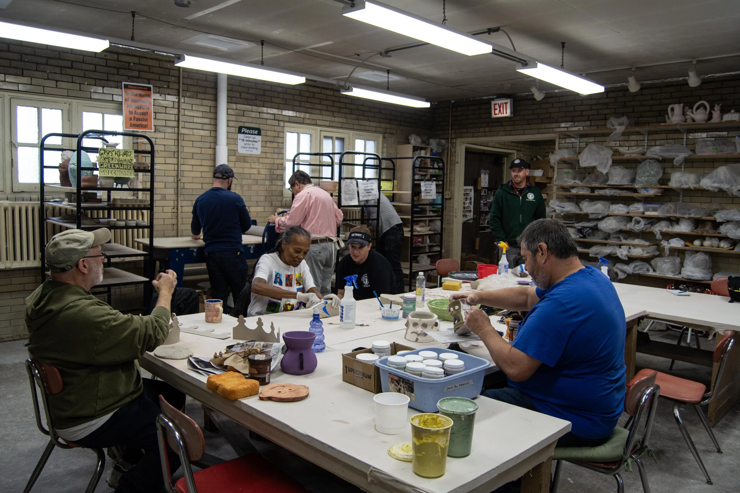 Four participants and four instructors occupy the studio while completing various tasks on Wednesday, Nov. 4, 2025. Though eight people are enrolled in the course this semester, usually about half show up each week from 10:30 a.m. to 12:30 p.m. to co