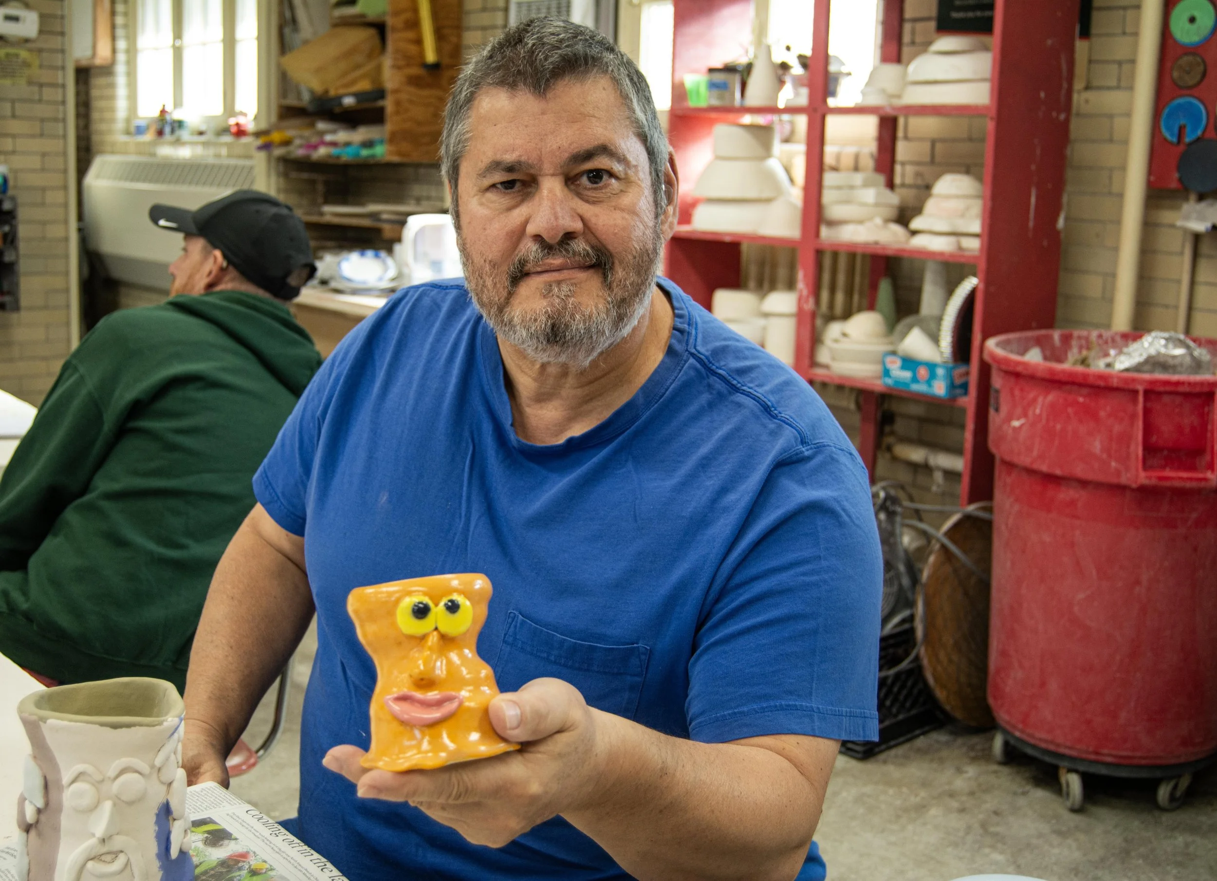Herminio Cardona Jr. shows off one of his finished pieces at the end of class on Wednesday, Nov. 4, 2025.