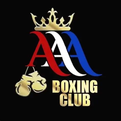 Logo for AAA Boxing Club featuring a gold crown, red, white, and blue stylized letter A's, and gold boxing gloves with a chain design.