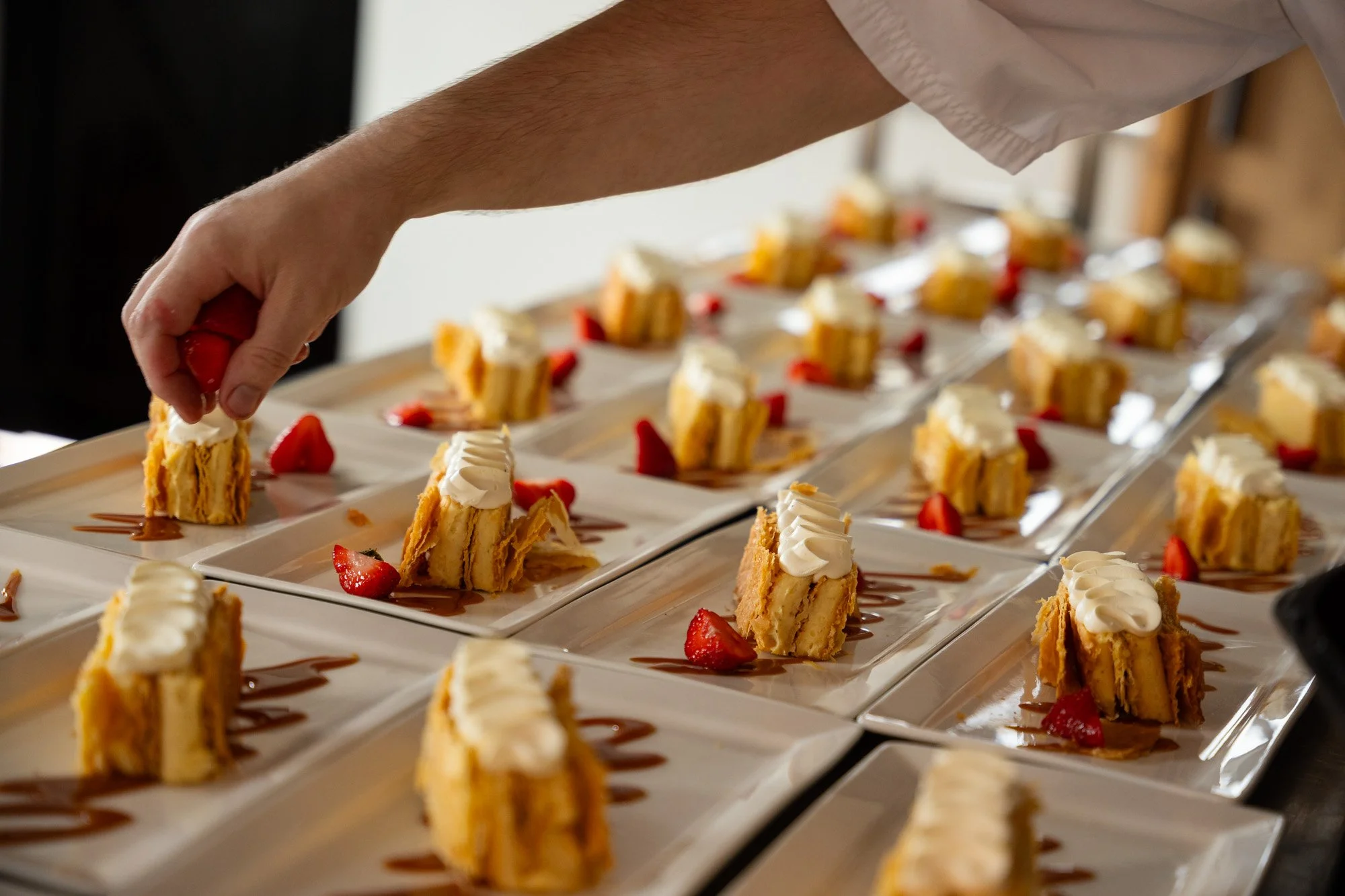 spiros wedding caterers - adding fruit to many desserts