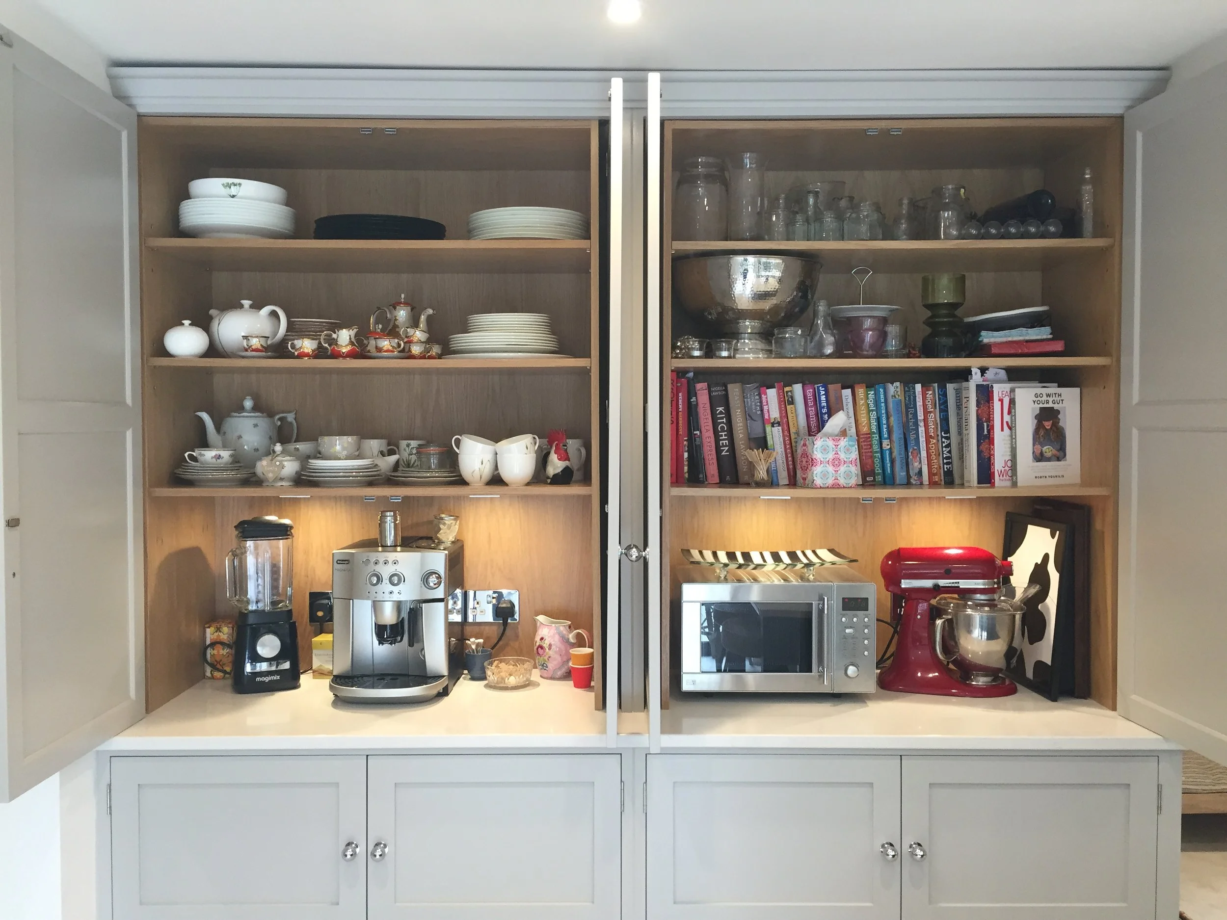 Bespoke painted kitchen cabinet with integrated storage for appliances, crockery and display items