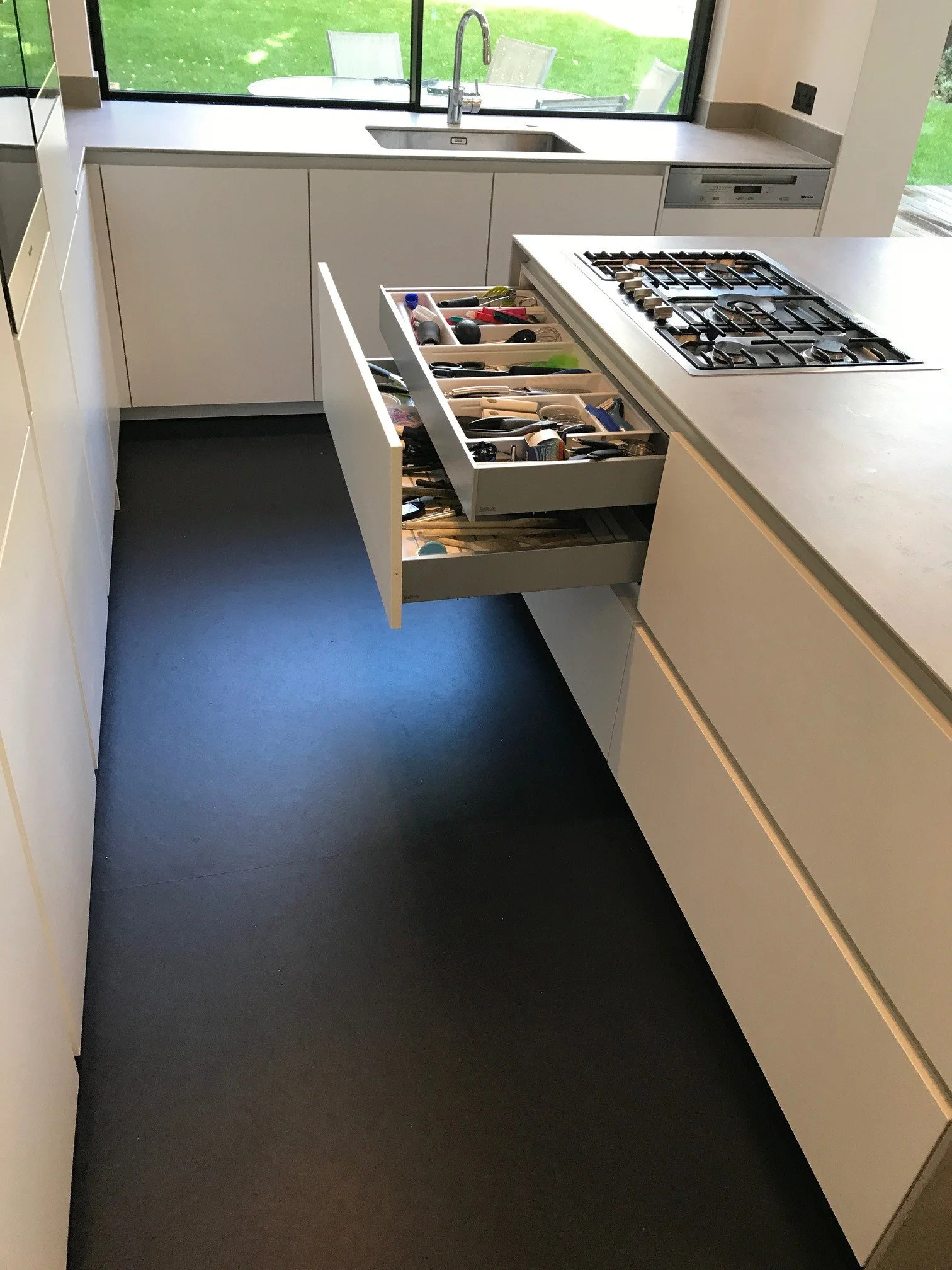 Bespoke kitchen island cabinetry with practical drawer storage