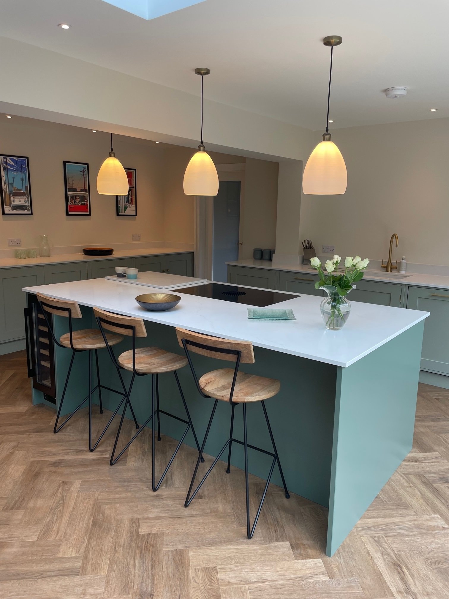 Kitchen island with informal seating in a bespoke family kitchen