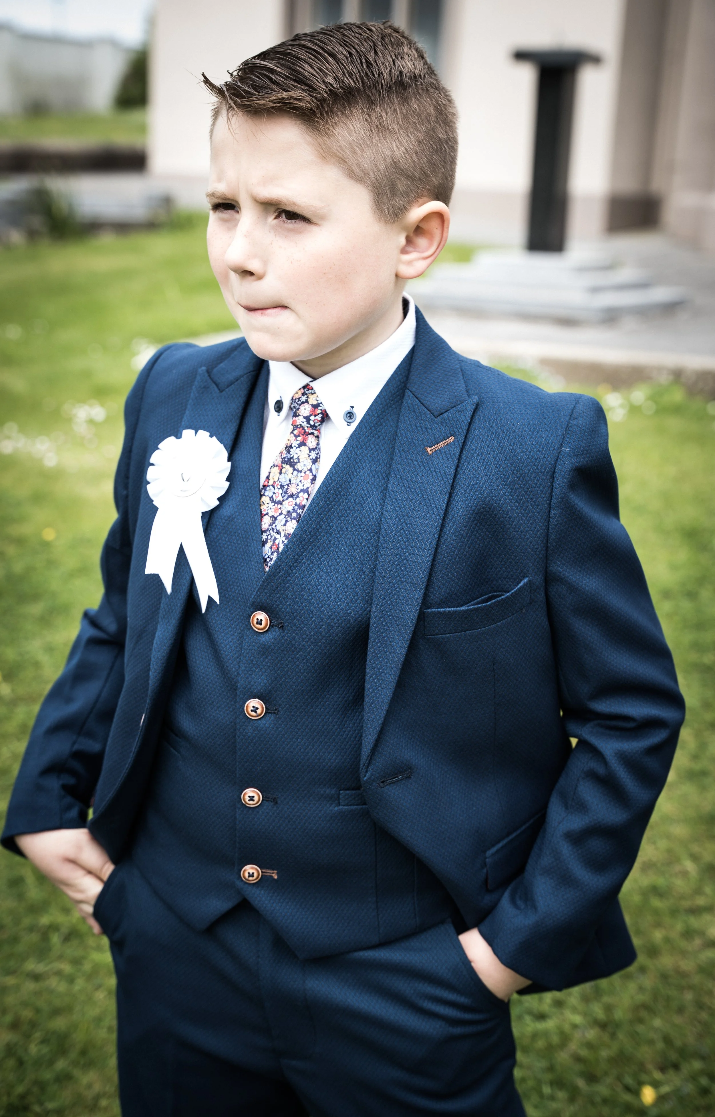 A portrait of a young boy in a navy suit after his first holy Communion in Tralee, Co.Kerry