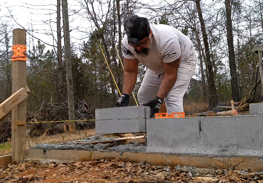 Laying blocks/foundation of a building