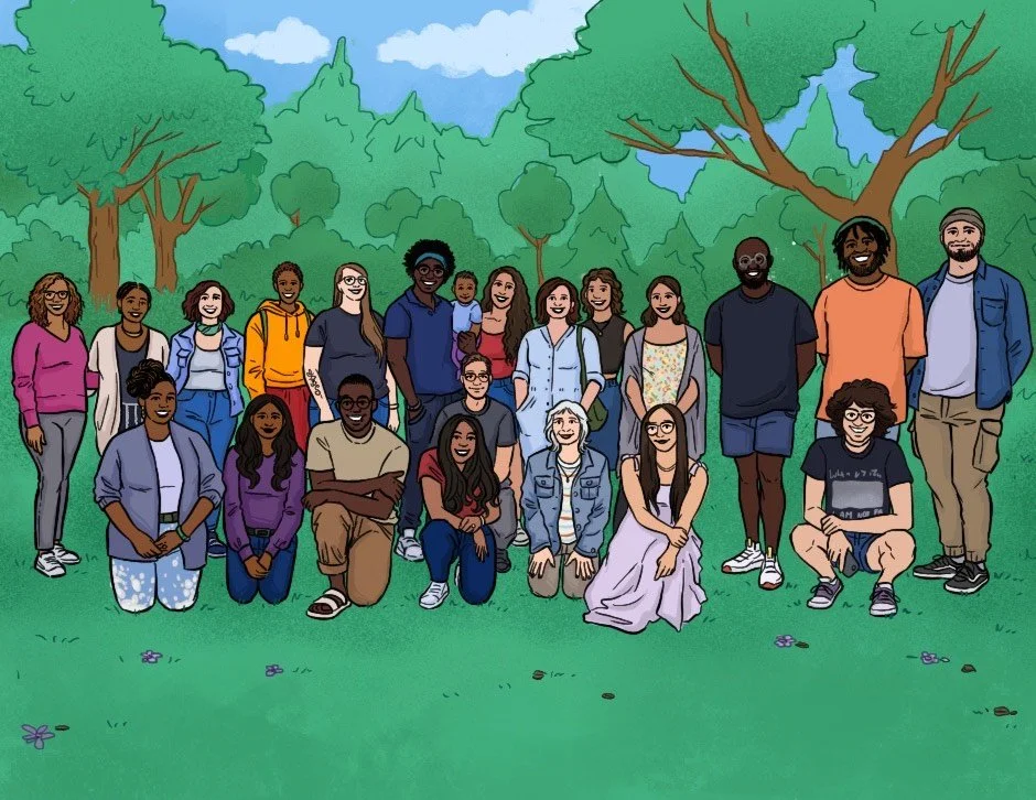 A diverse group of people posing outdoors in a park with trees and grass.