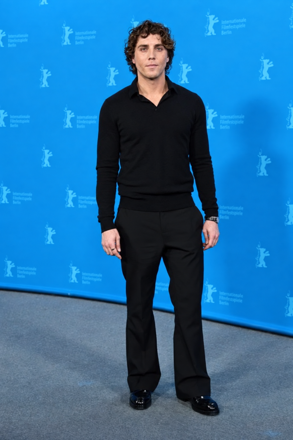 Lukas Gage at the Rosebush Pruning photocall during Berlinale 2026, with hair, makeup and grooming by Jenna Smith.