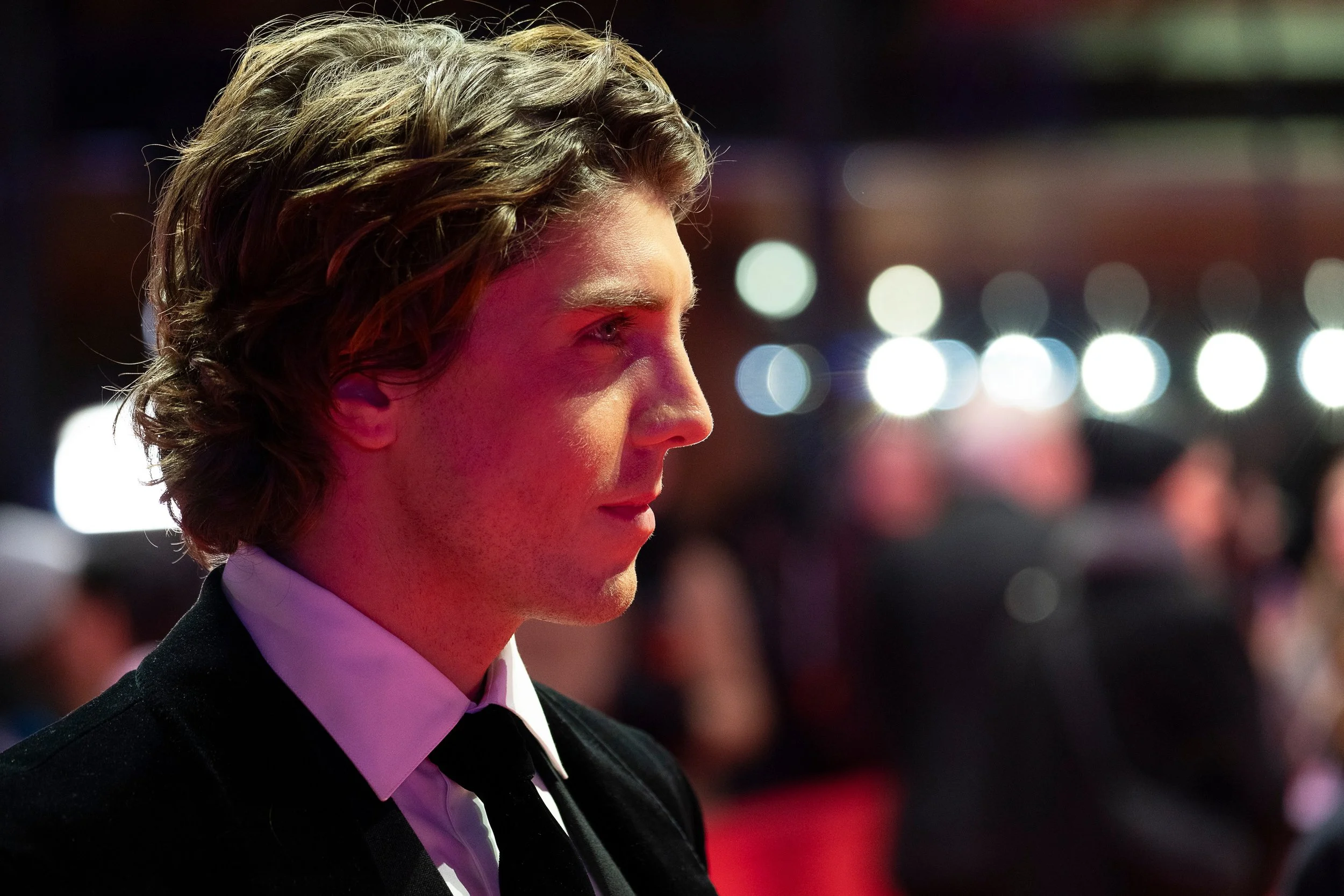 Lukas Gage at the Rosebush Pruning premiere during Berlinale 2026, with hair, makeup and grooming by Jenna Smith.
