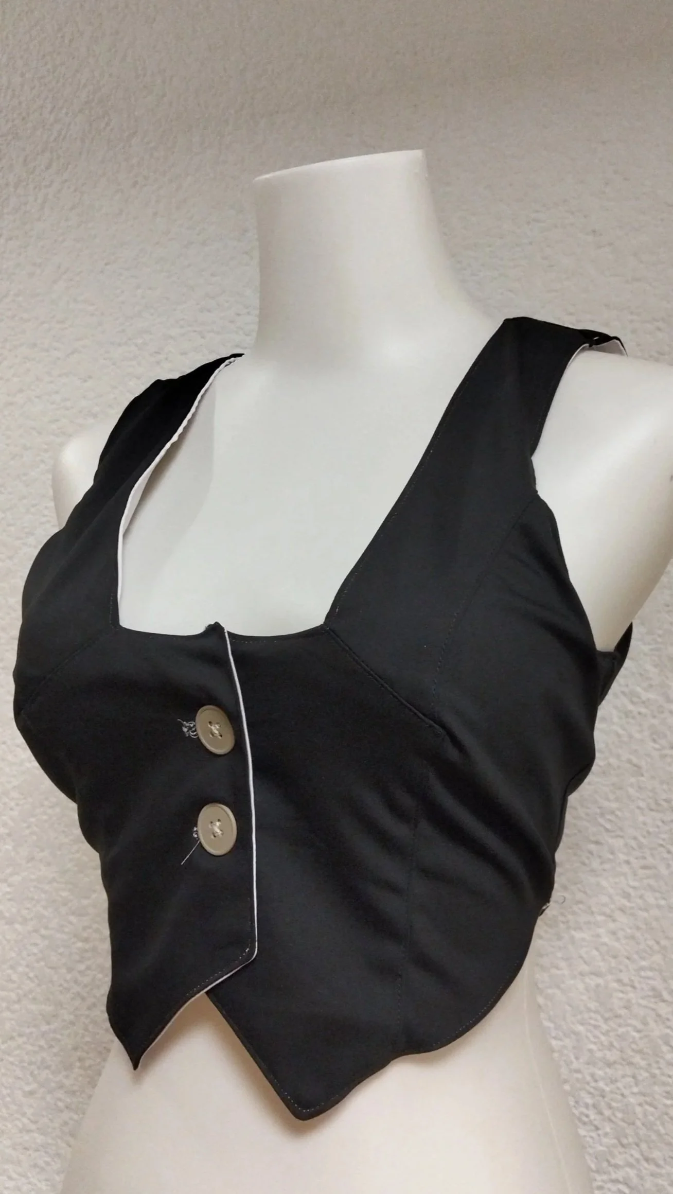 Chaleco blanco de botones.