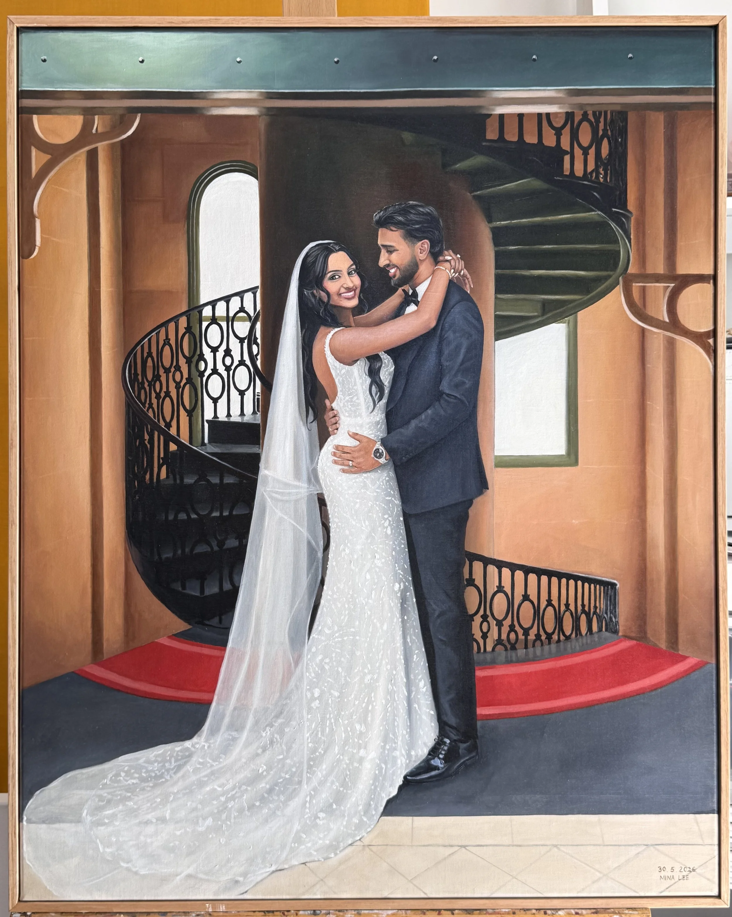 Painting of a bride and groom embracing on a staircase in a venue with wooden wall panels and a red carpeted floor. The bride is in a white lace wedding dress with a veil, and the groom is in a dark suit with a watch. The staircase has black wrought iron railings, and there is a window with a rounded top behind them. The artist's name and date are in the bottom right corner.