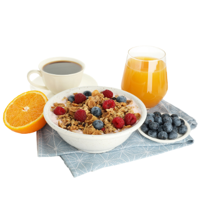 A breakfast setting with a bowl of granola topped with raspberries and blueberries, a glass of orange juice, a cup of black coffee, a plate of blueberries, and a half orange on a blue cloth napkin.