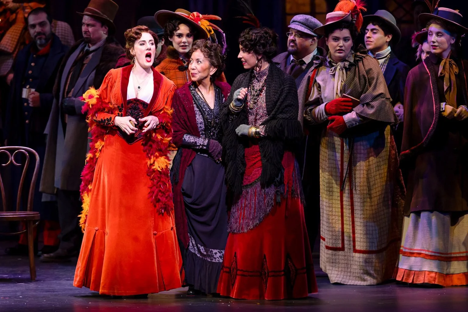 Sydney Mancasola as Musetta, left, performs with members of the Palm Beach Opera chorus in Puccini's La bohème, playing through Jan. 25 at the Kravis Center for the Performing Arts in West Palm Beach