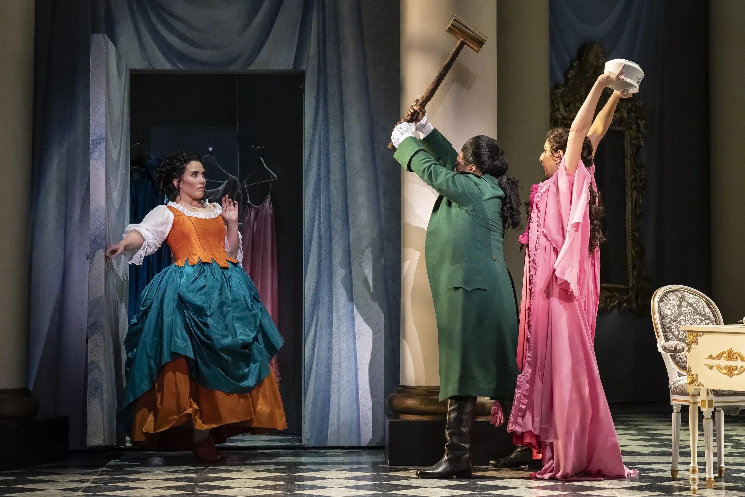 Susanna (Joélle Harvey) emerges as the surprise noise maker in the closet while the Count (Will Liverman) and Countess (Rosa Feola) are poised for action. Photo by Scott Suchman; courtesy of Washington National Opera.
