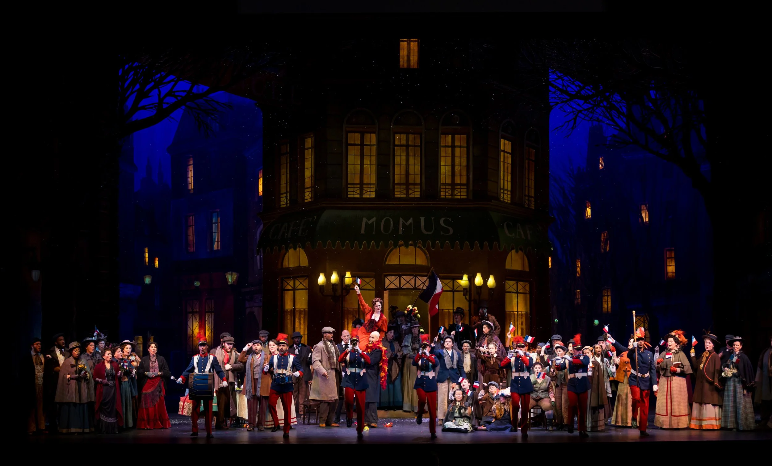 The Palm Beach Opera chorus at Café Momus in Puccini's La bohème, performing live at the Kravis Center.