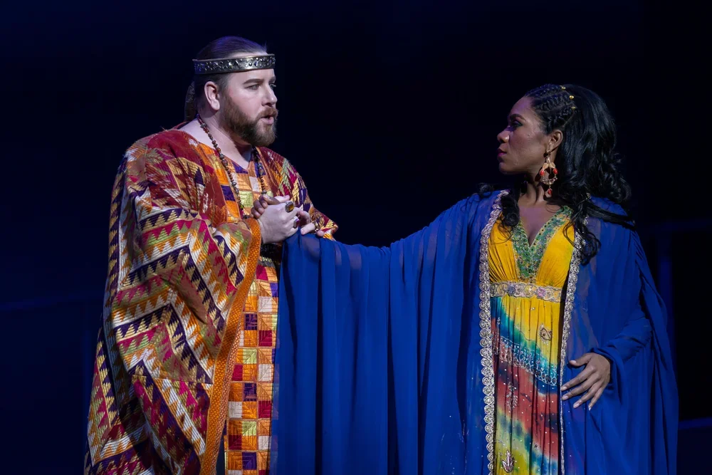 The High Priest of Dagon (Noel Bouley) appeals to Delilah (J’Nai Bridges) for help. Photos by Scott Suchman; courtesy of Washington National Opera.

