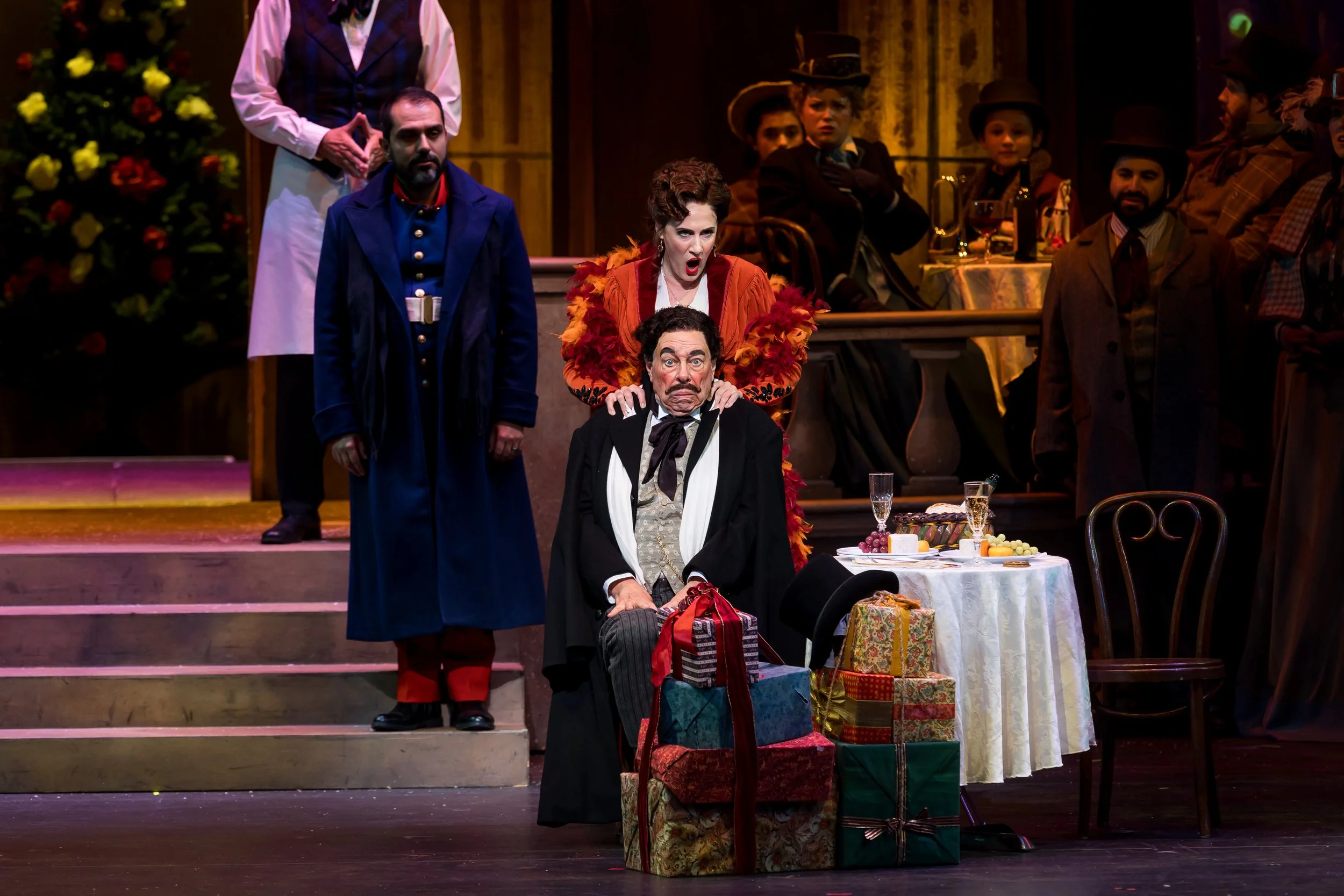 Sydney Mancasola as Musetta, left, performs with members of the Palm Beach Opera chorus in Puccini's La bohème, playing through Jan. 25 at the Kravis Center for the Performing Arts in West Palm Beach