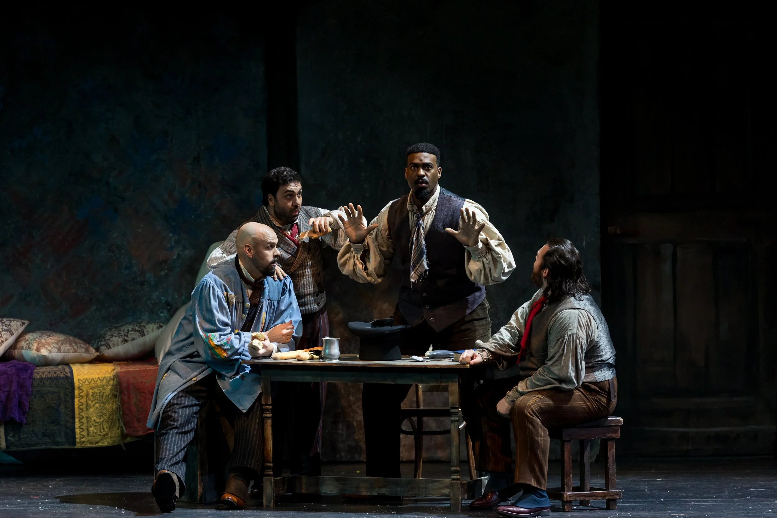 Liparit Avetisyan as Rodolfo, Edward Parks as Marcello, Soloman Howard as Colline, and Mario Manzo as Schaunard perform in Palm Beach Opera's production of Puccini's La bohème at the Kravis Center in West Palm Beach.