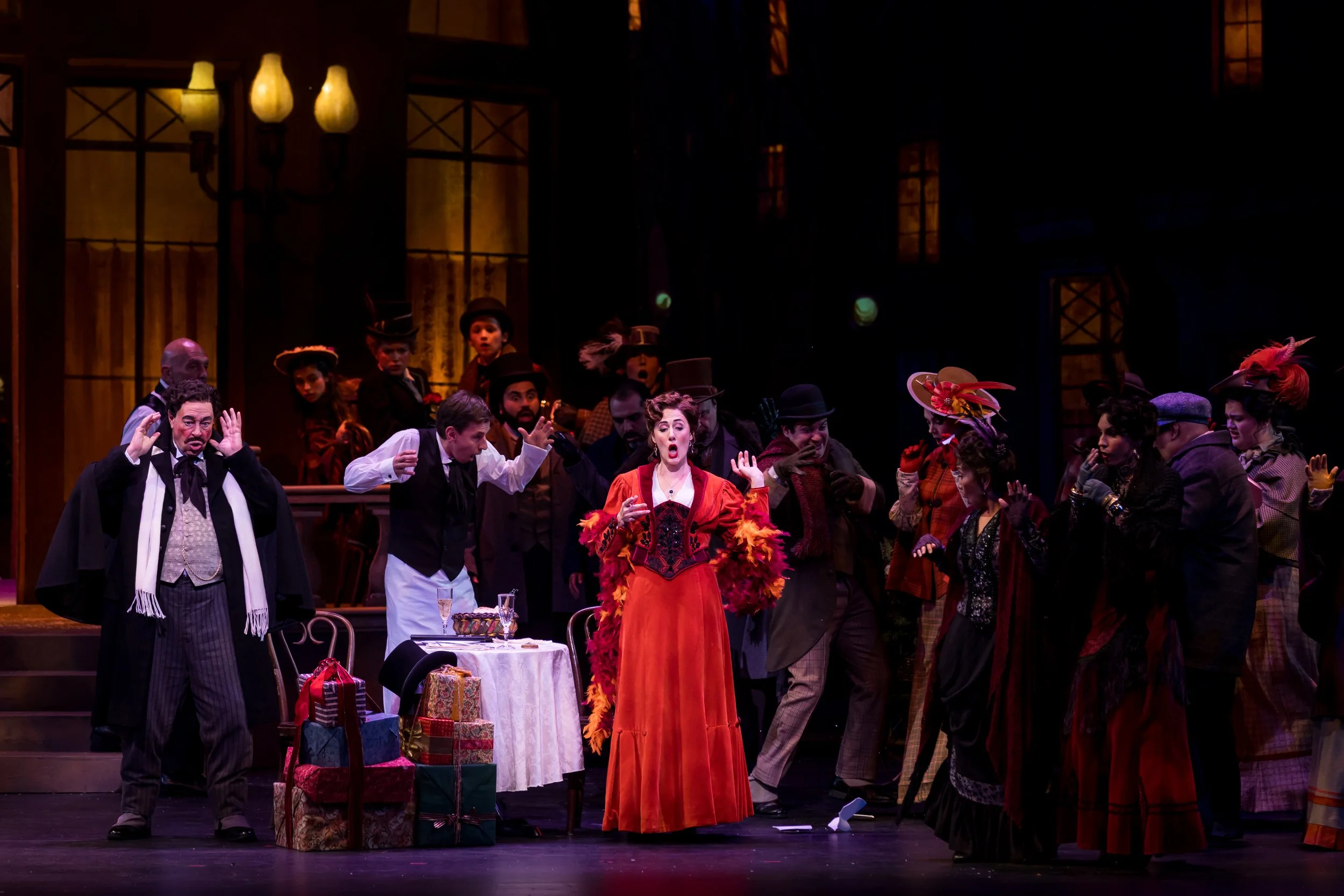 Sydney Mancasola as Musetta, left, performs with members of the Palm Beach Opera chorus in Puccini's La bohème, playing through Jan. 25 at the Kravis Center for the Performing Arts in West Palm Beach