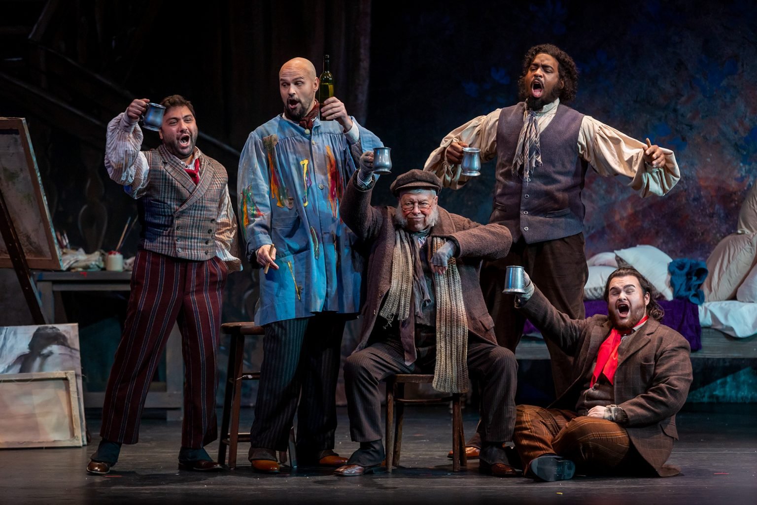Liparit Avetisyan as Rodolfo, left, Edward Parks as Marcello, Donald Maxwell as Benoît, Soloman Howard as Colline, and Mario Manzo as Schaunard perform in Palm Beach Opera's production of Puccini's La bohème at the Kravis Center in West Palm Beach.
