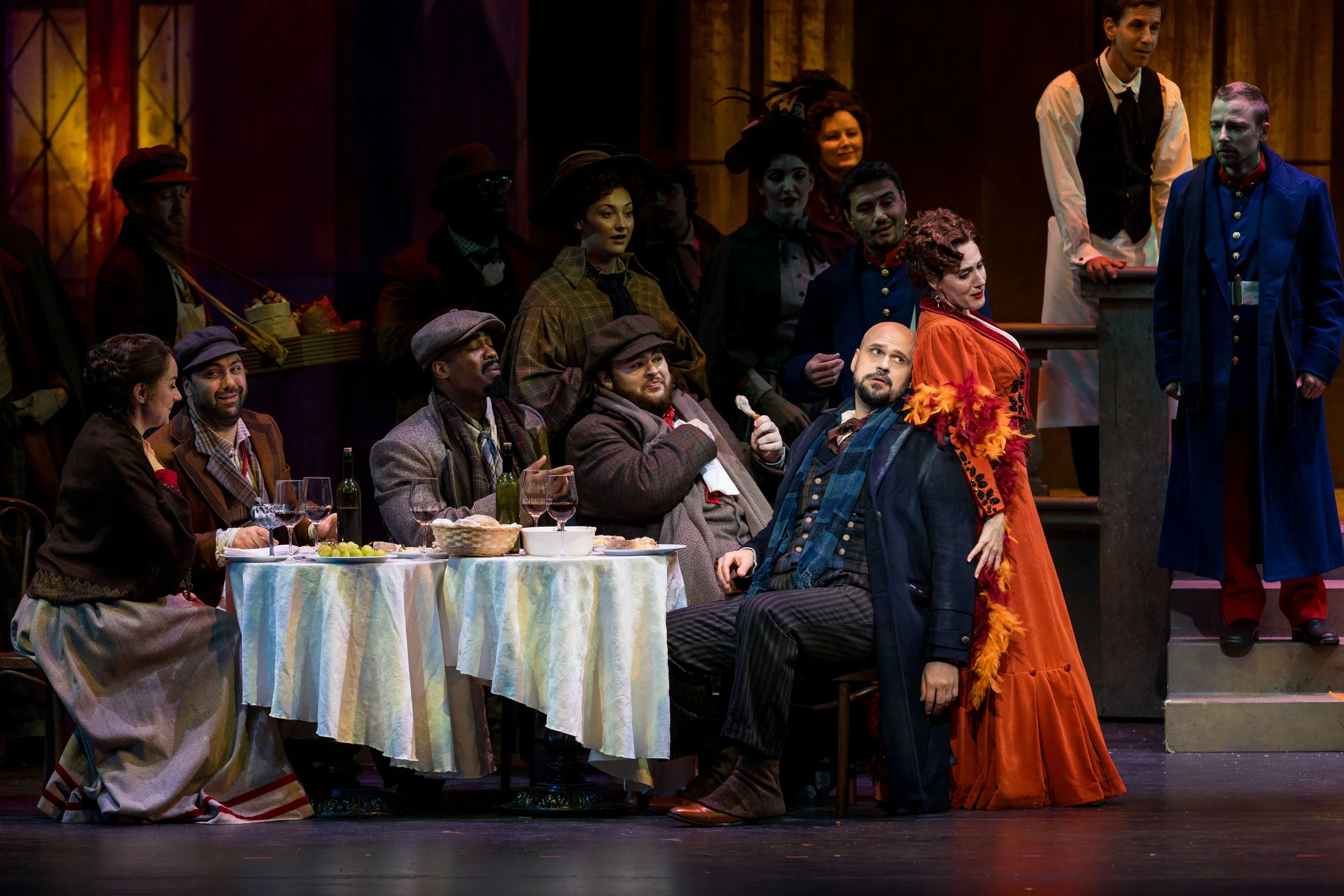 Sydney Mancasola as Musetta, left, performs with members of the Palm Beach Opera chorus in Puccini's La bohème, playing through Jan. 25 at the Kravis Center for the Performing Arts in West Palm Beach