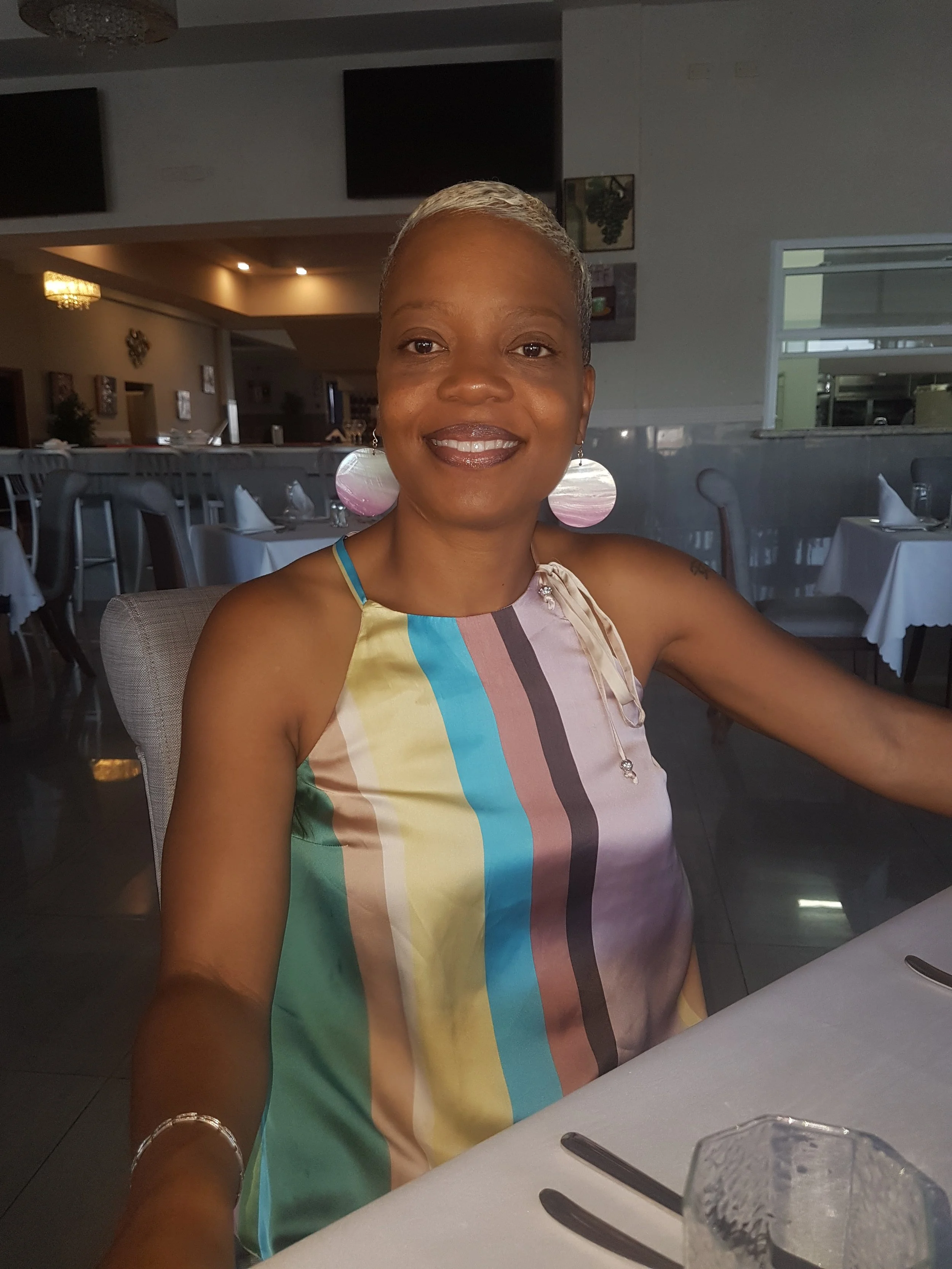 a picture of Marguerite, a black woman, smiling. 