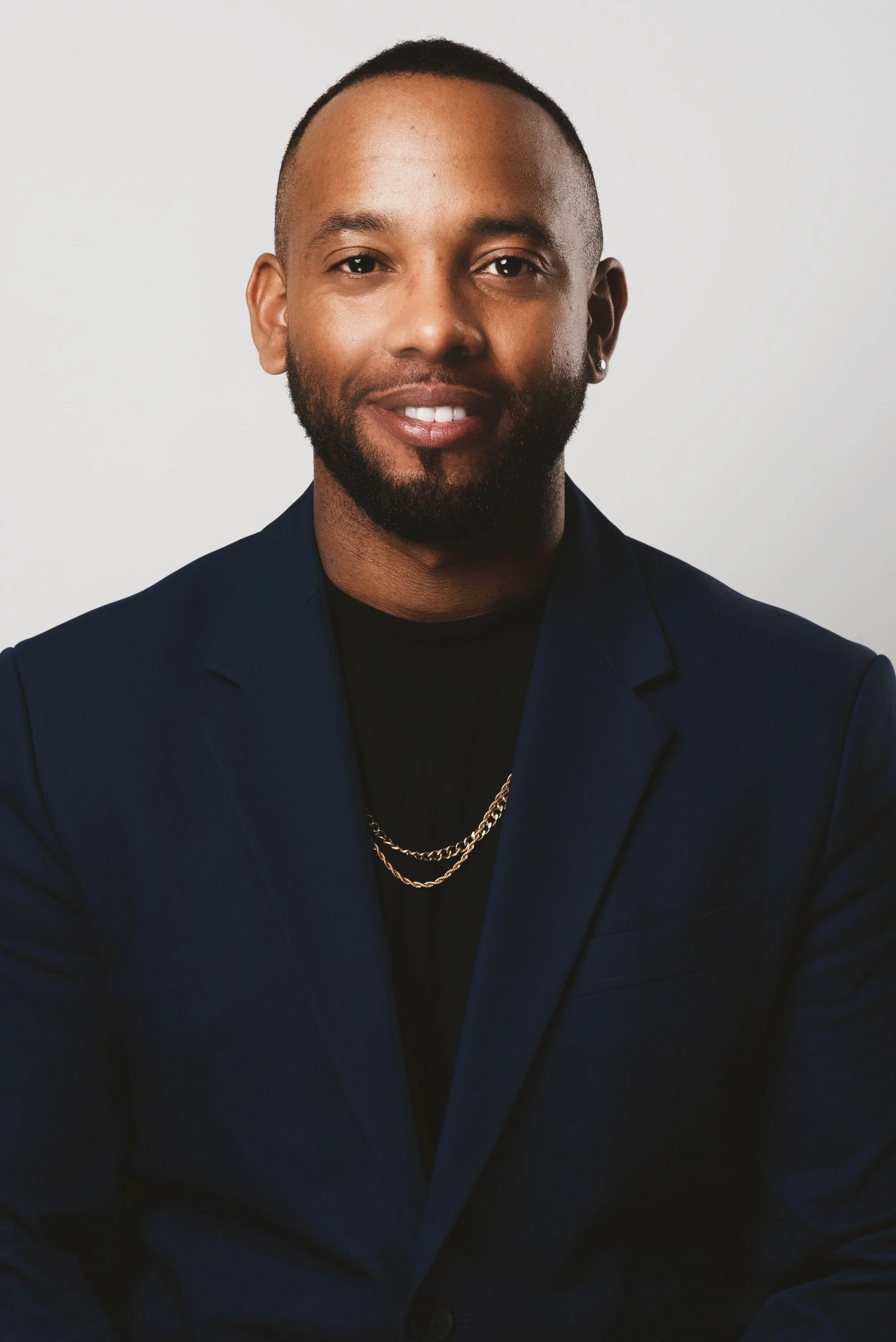 a picture of Nyall, a black man, smiling. 