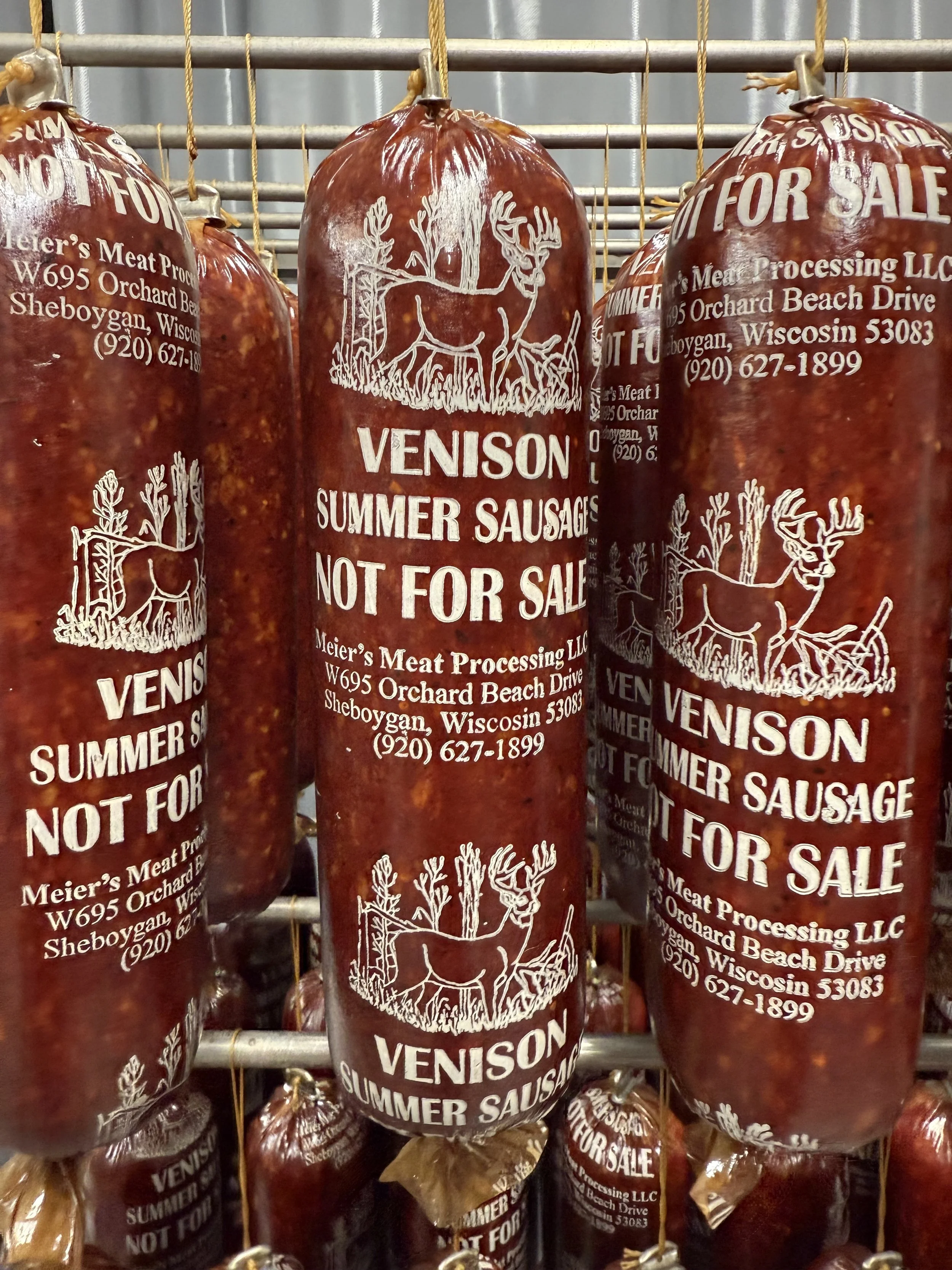 Package of venison summer sausages labeled "Not For Sale" with a white reindeer and tree illustration, including the address and phone number of Meier's Meat Processing in Sheboygan, Wisconsin.