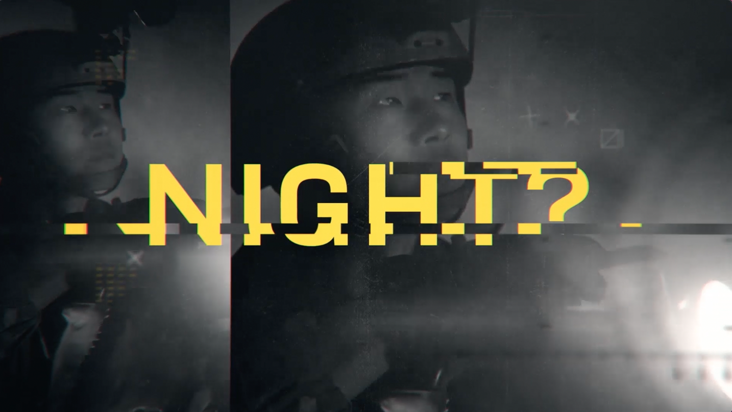 A distorted image of police officers with a glitching yellow text that reads 'NIGHT?' overlayed on top.
